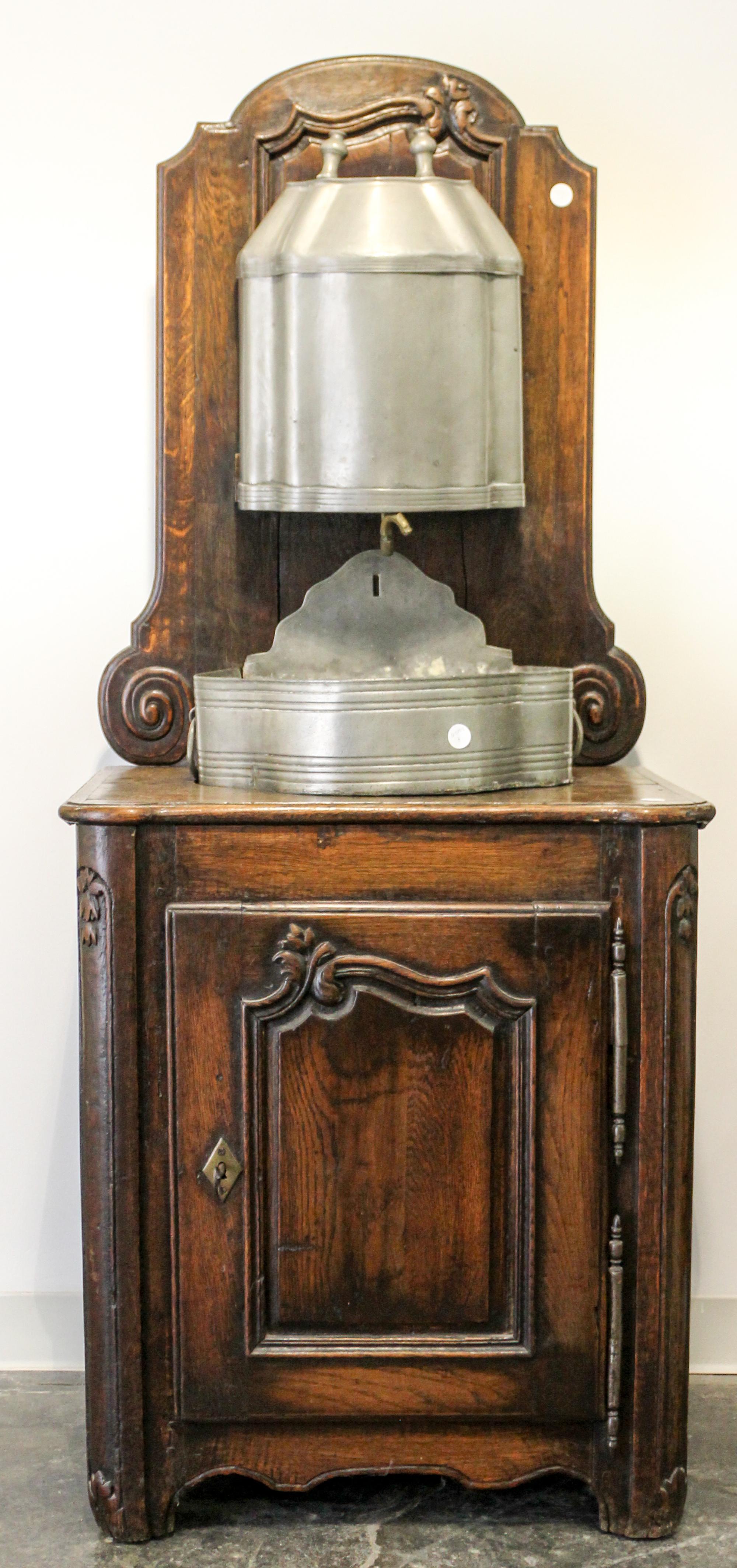 A Wash Stand with Pewter Lavabo and Basin Height 64 1/2 x width 27 x depth 18 1/4 inches.