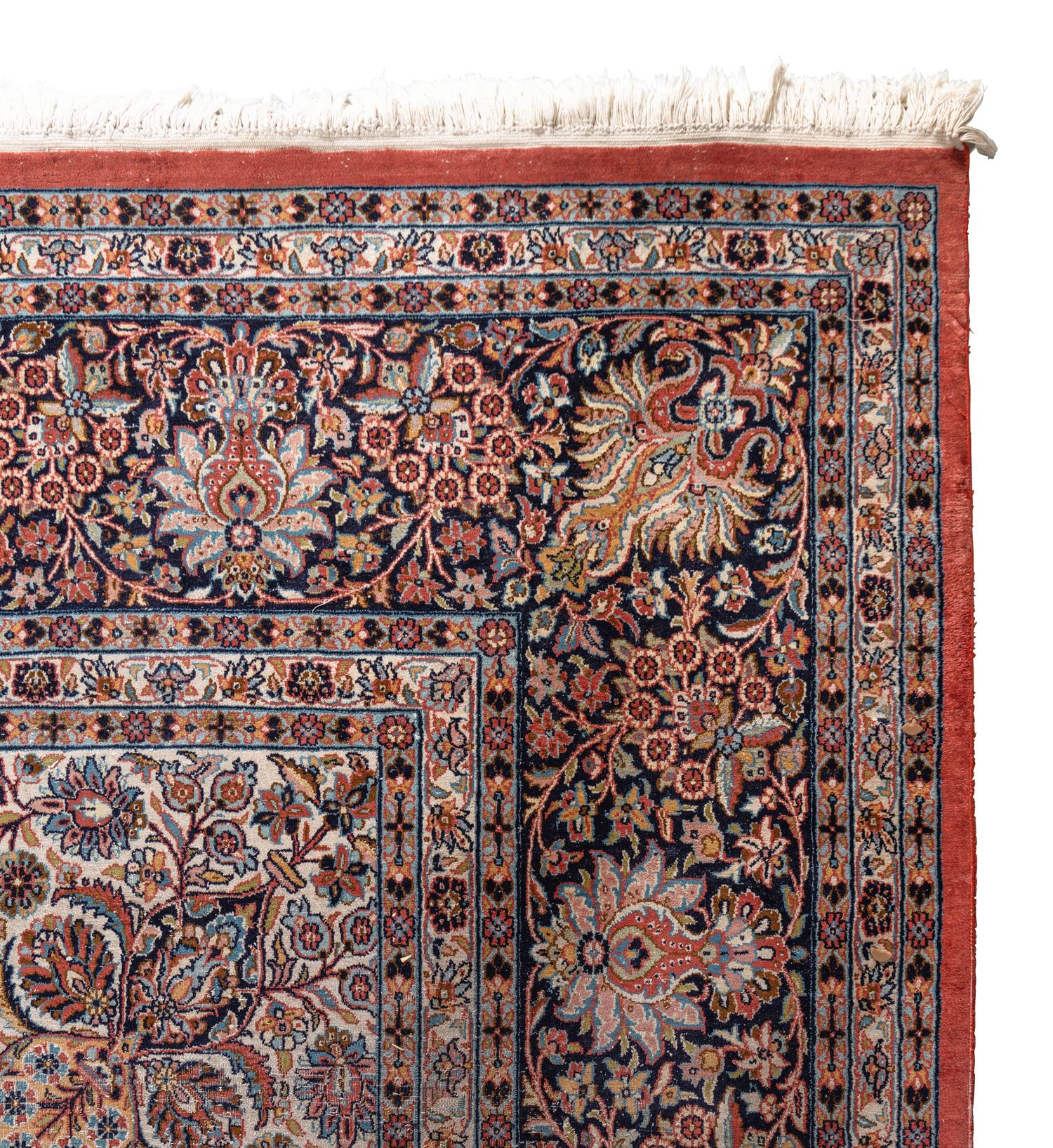 A Qom Wool and Silk Rug