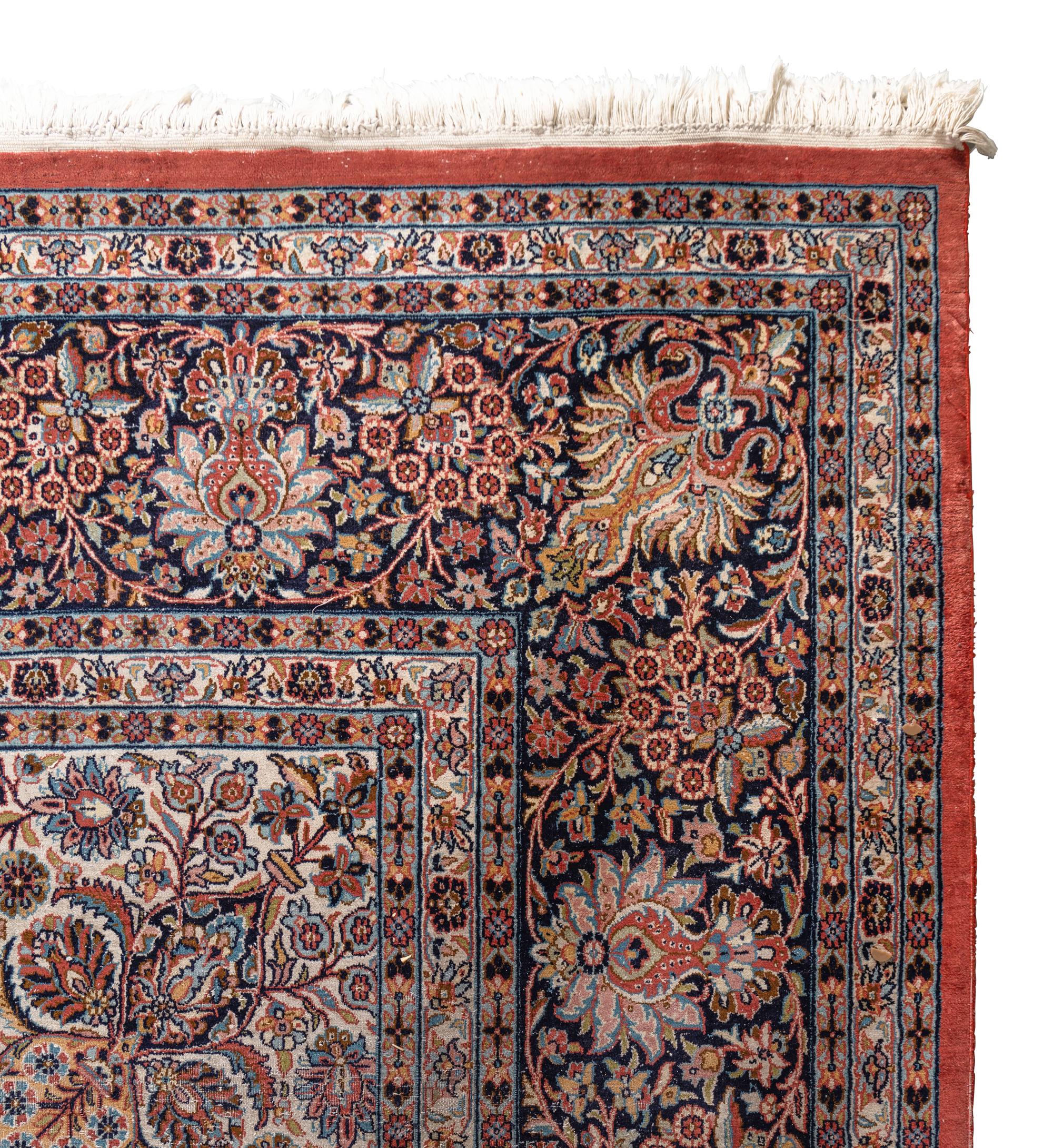 A Qom Wool and Silk Rug