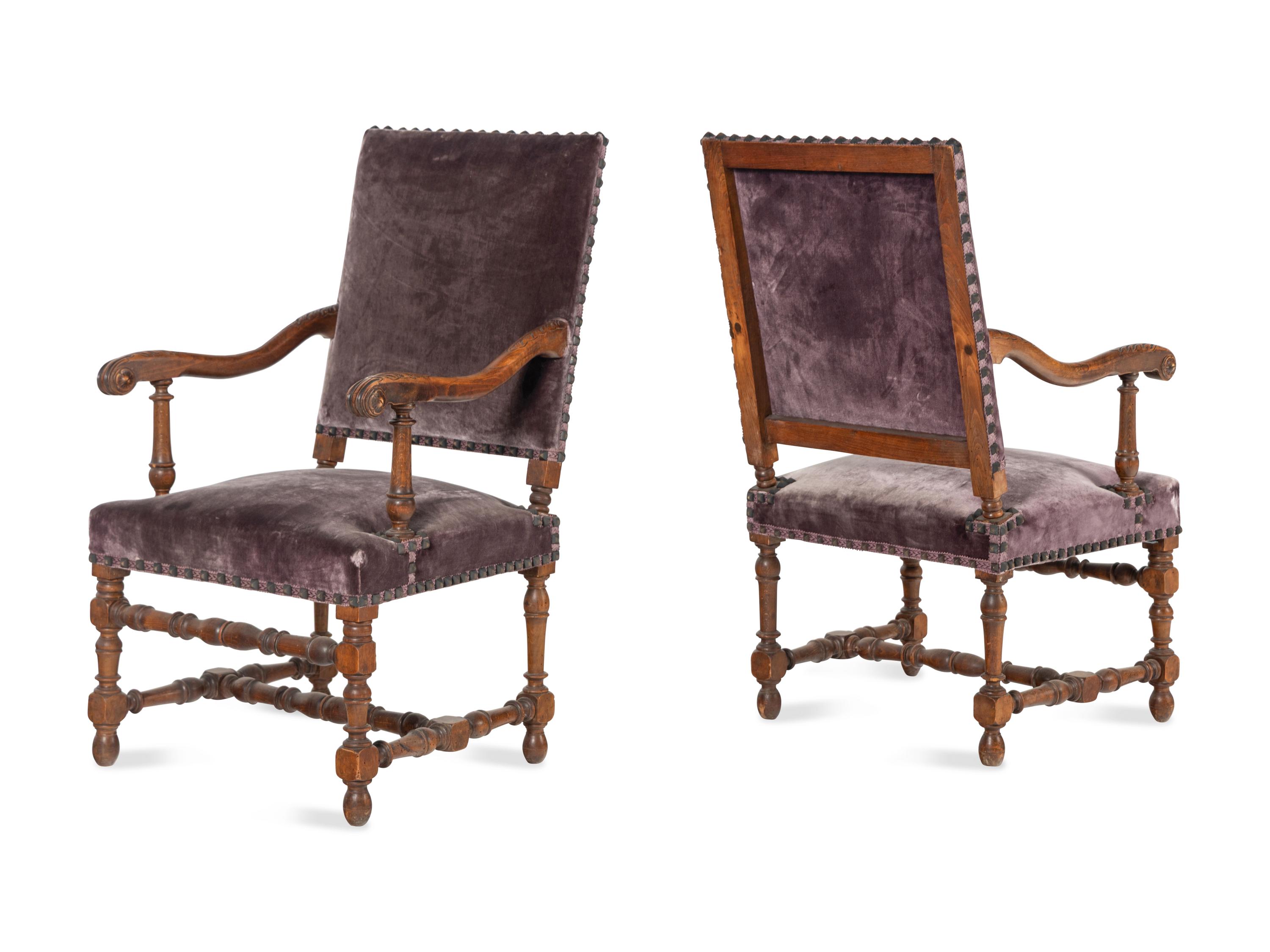 A Pair of Louis XIV Style Carved Fruitwood Fauteuils