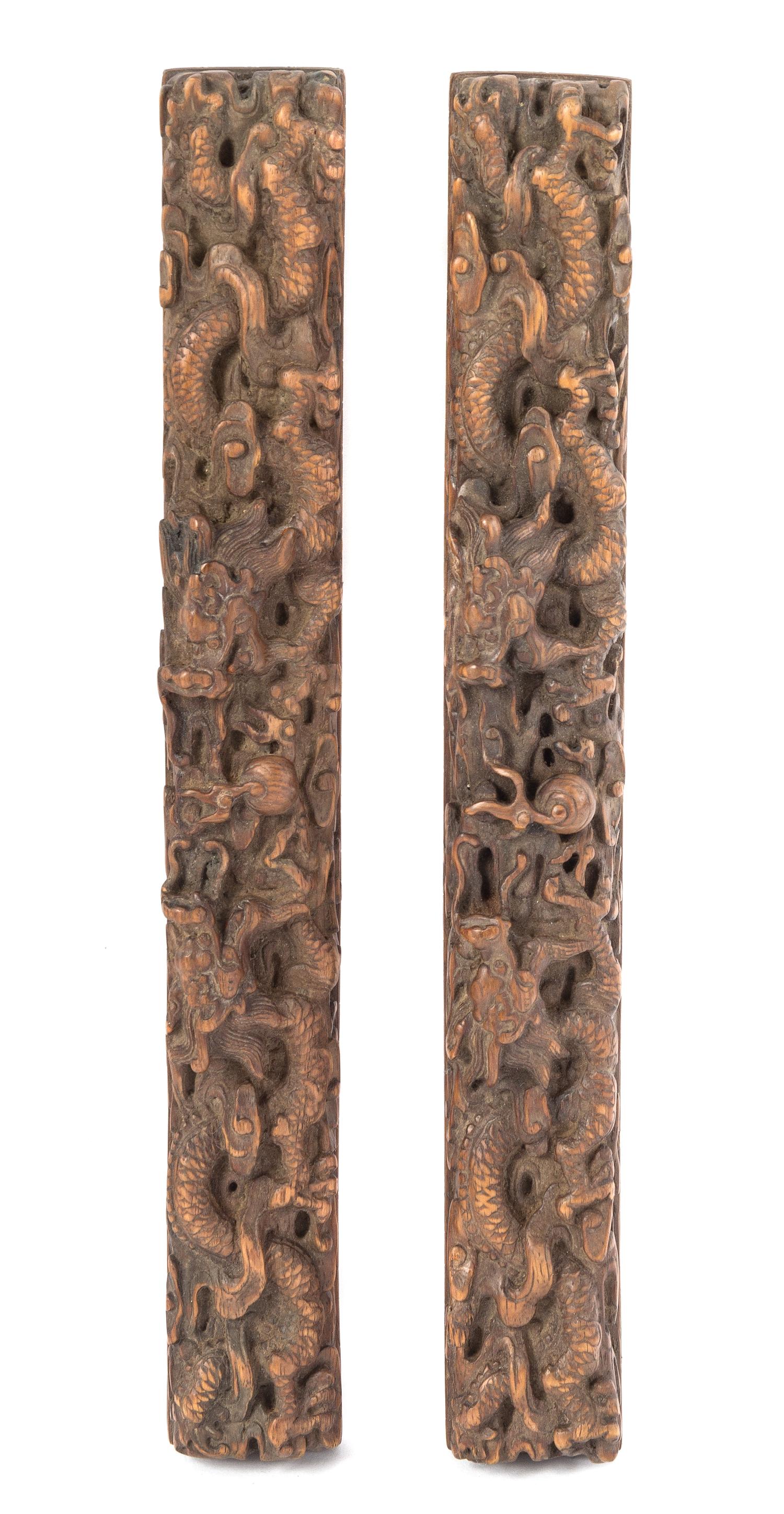A Pair of Boxwood Scroll Weights Length 12 1/4 inches.
