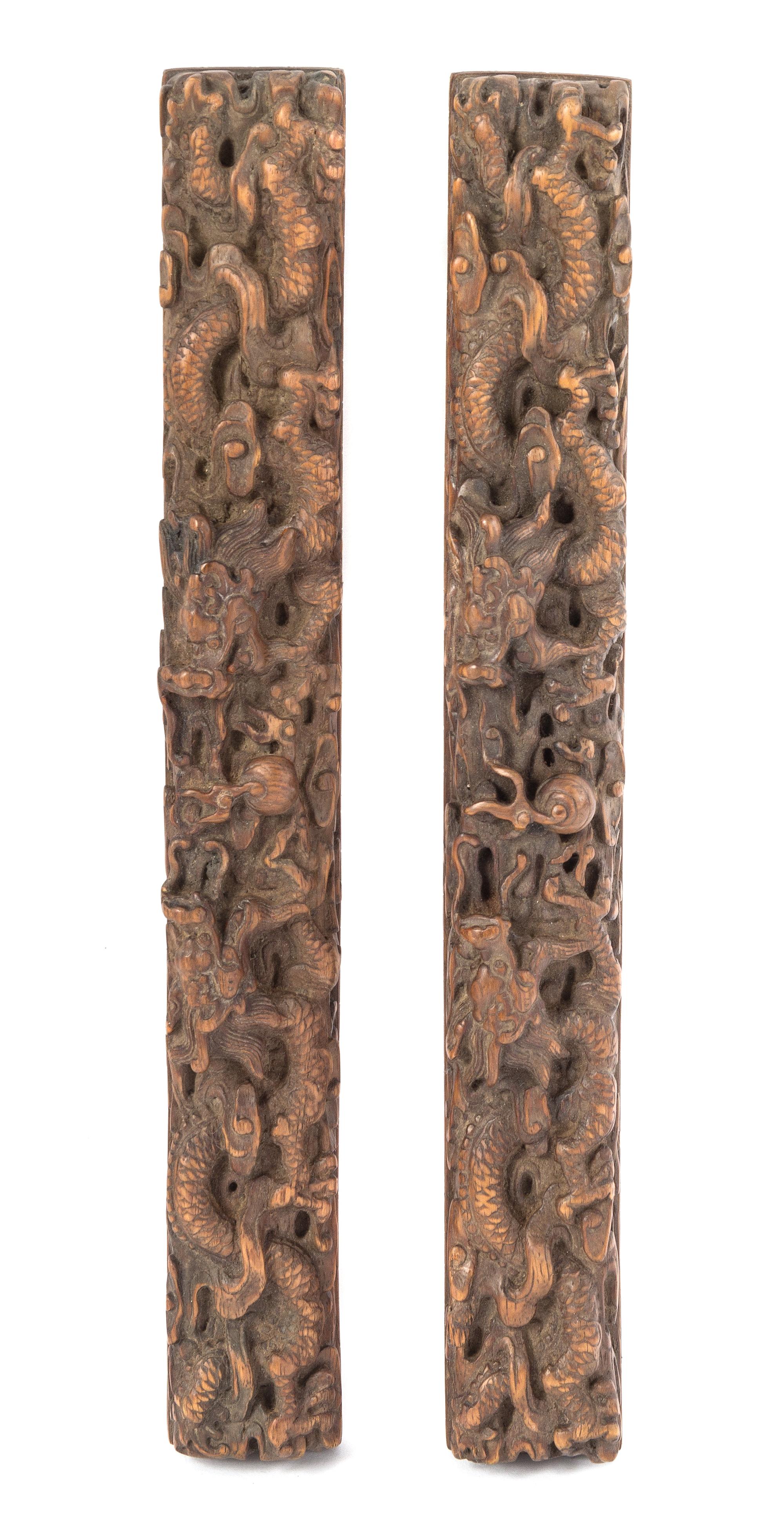 A Pair of Boxwood Scroll Weights Length 12 1/4 inches.