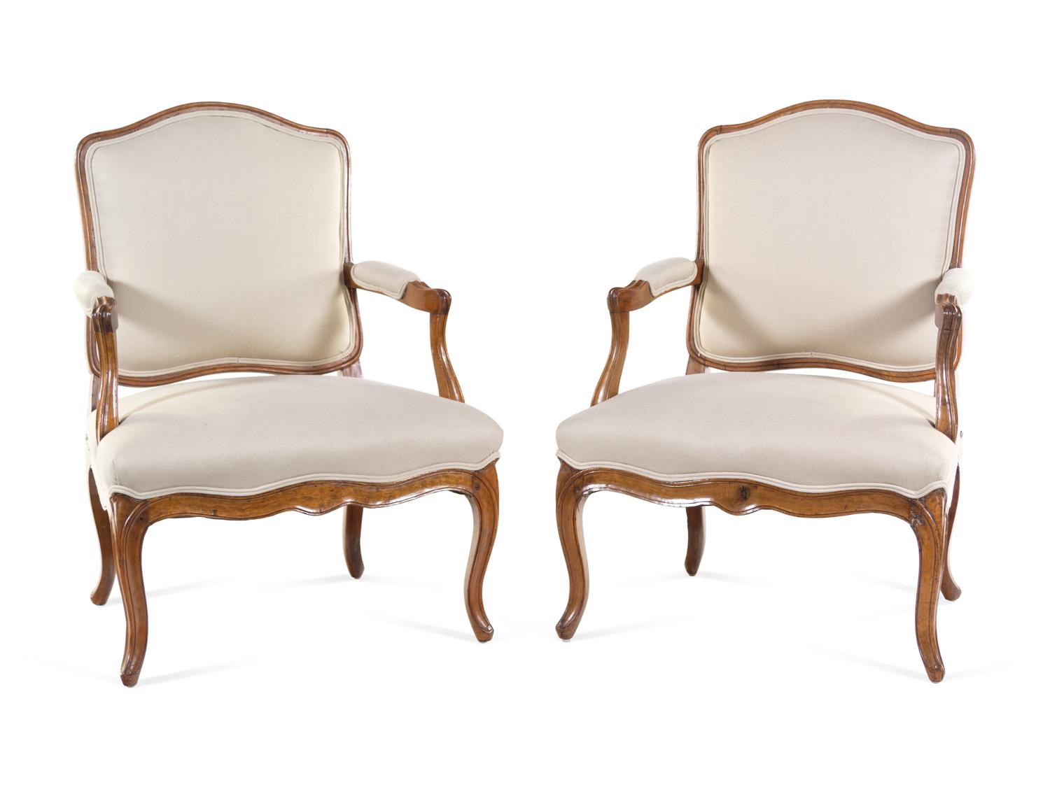 A Pair of Louis XV Carved Beechwood Fauteuils