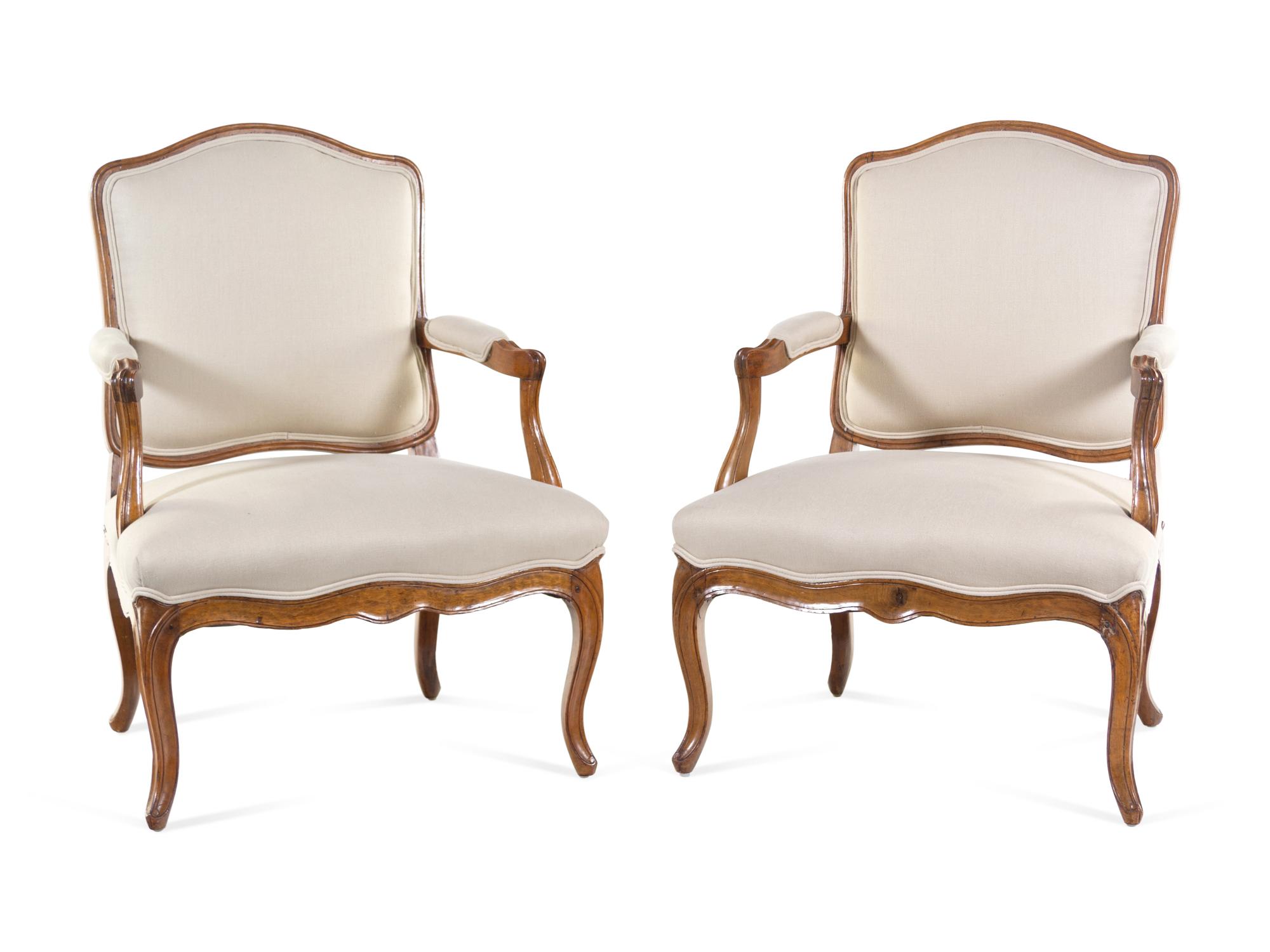 A Pair of Louis XV Carved Beechwood Fauteuils