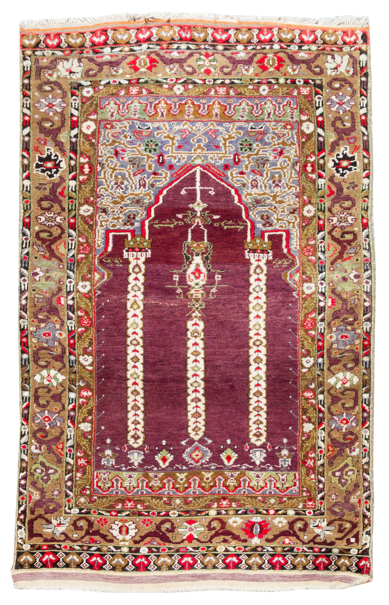A Turkish Prayer Rug 7 feet 1 inch x 3 feet 10 inches.