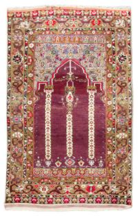 A Turkish Prayer Rug 7 feet 1 inch x 3 feet 10 inches.
