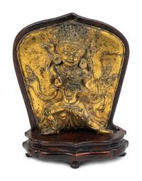 A Tibetan Gilt Bronze Repoussé Vajrapani Panel