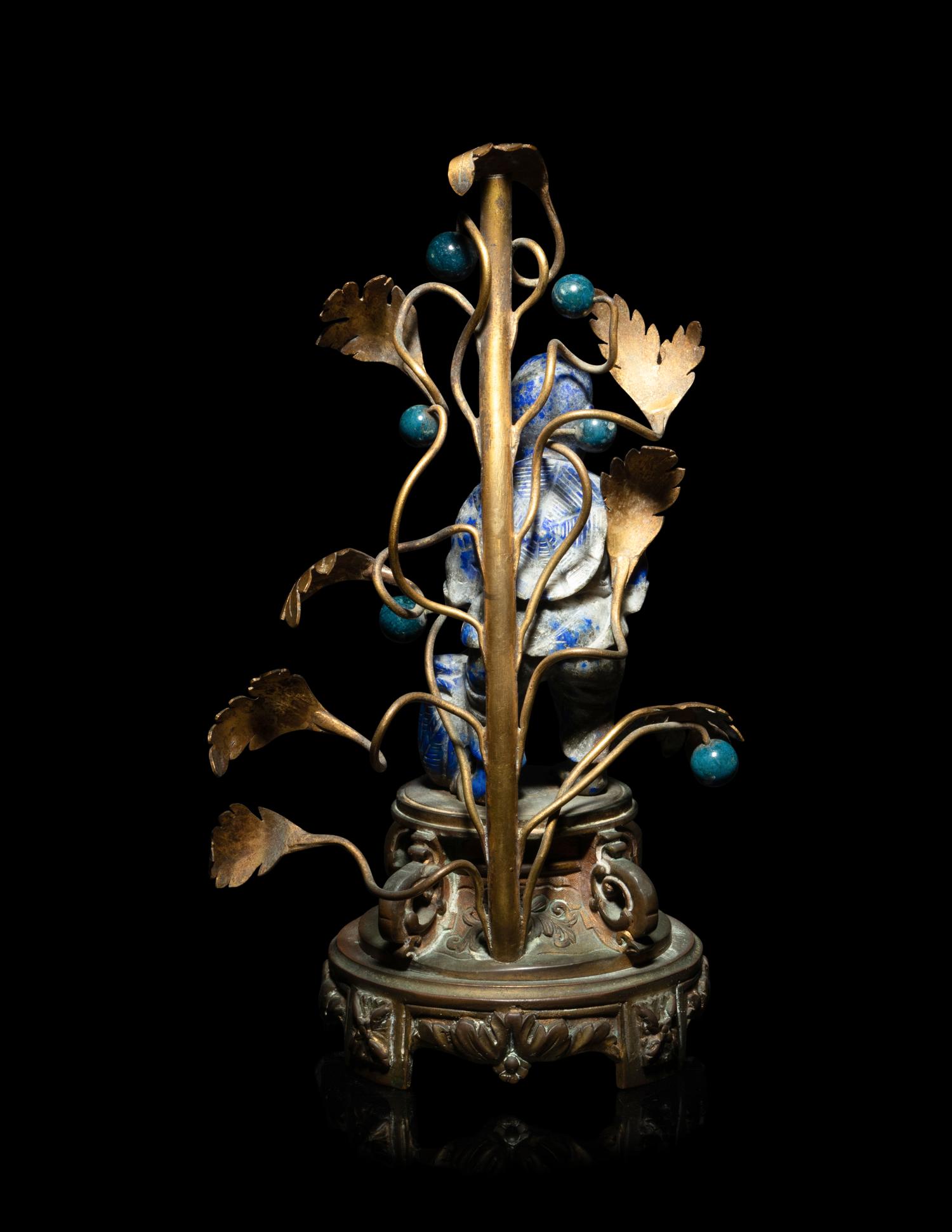 A Chinese Carved Lapis Lazuli Figure of a Fisherman