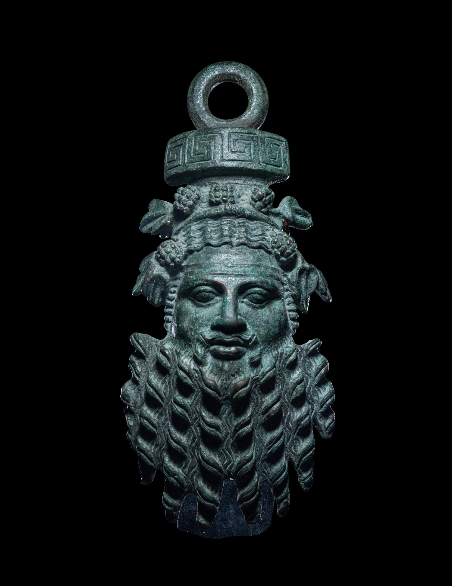 A Roman Bronze Applique Mask in the Form of Silenus