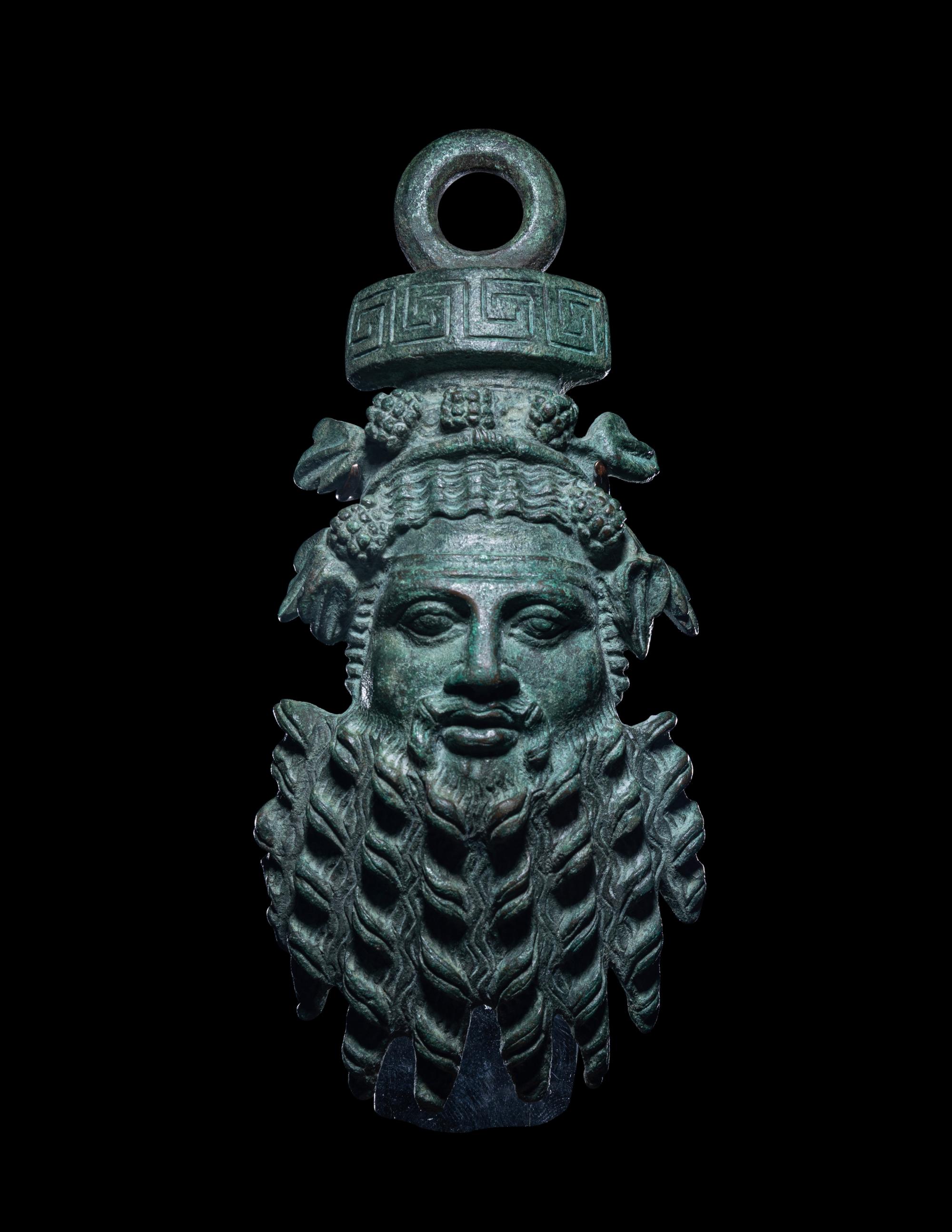A Roman Bronze Applique Mask in the Form of Silenus