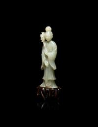 A Chinese Carved Pale Celadon Jade Standing Female Figure