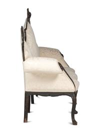 An Italian Carved and Black Painted Walnut High-Back Sofa