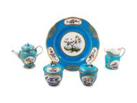 Five Sèvres Painted and Parcel Gilt Celeste Blue-Ground Porcelain Tea Service Articles