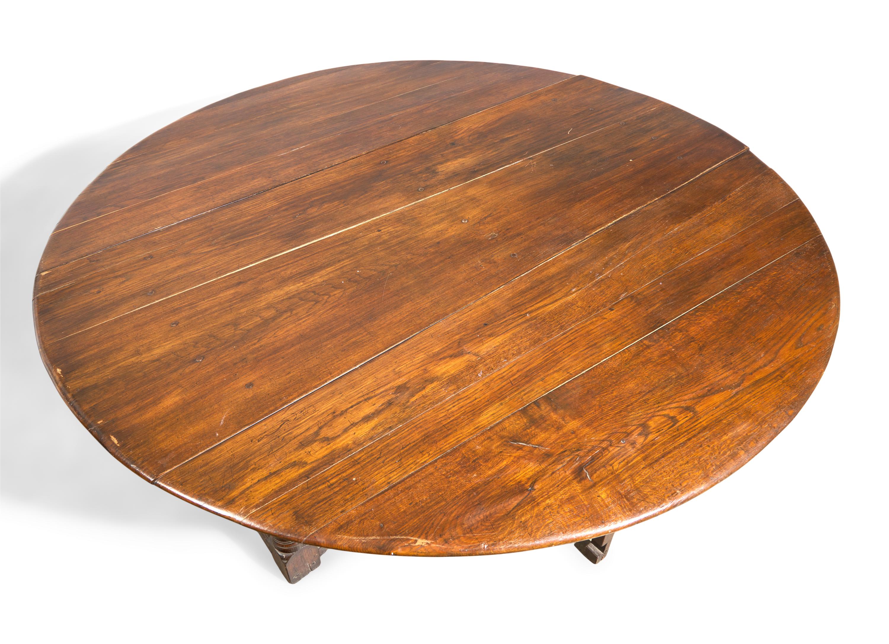 A Large Baroque Style Oak Drop-Leaf Dining Table