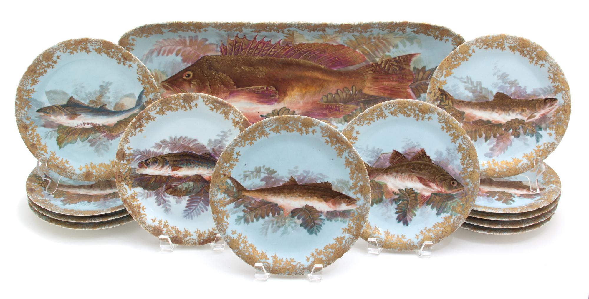 A Thirteen Piece Limoges Porcelain Fish Service EARLY 20TH CENTURY comprising twelve plates and... — EARLY 20TH CENTURY