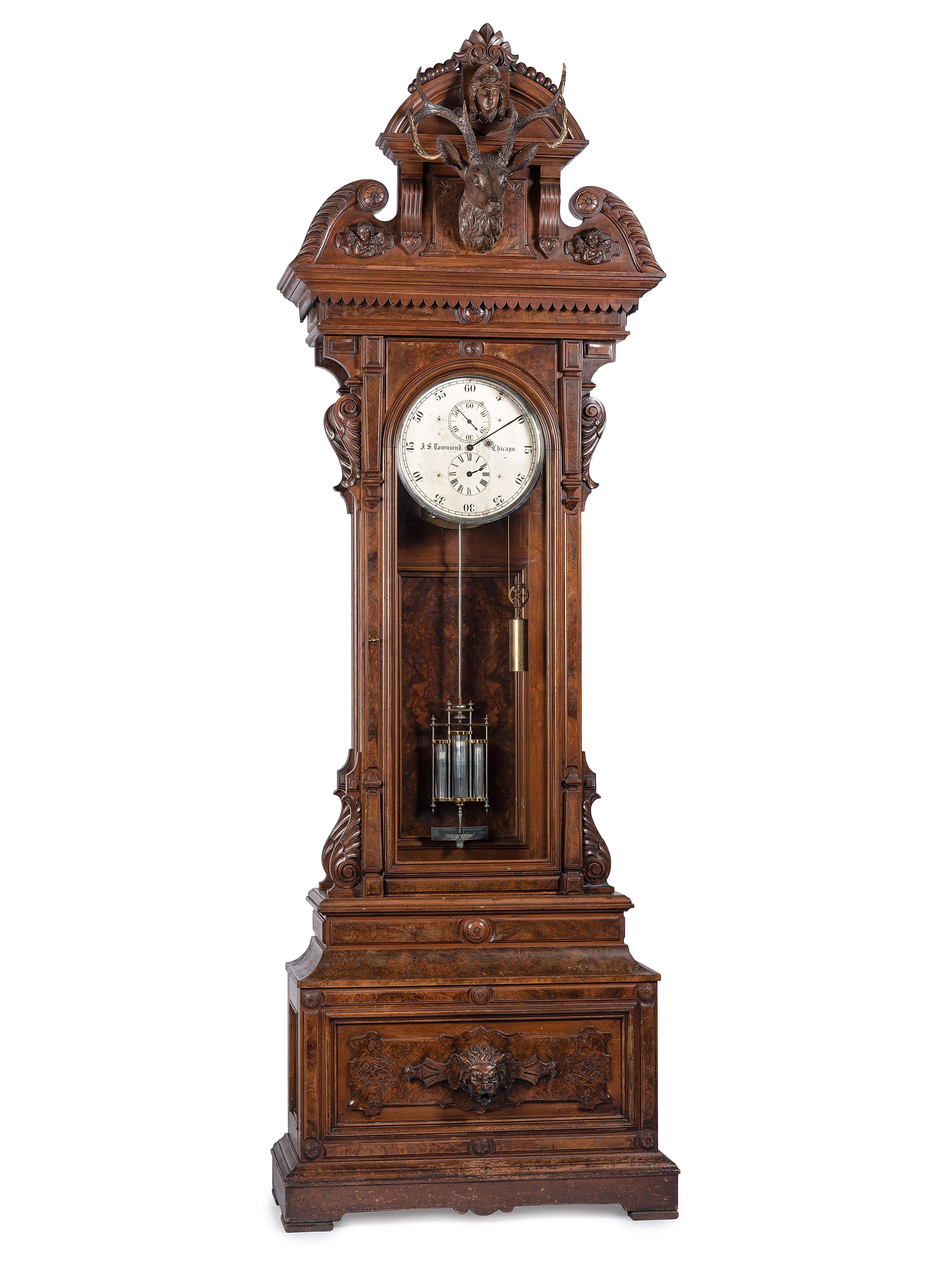 An Impressive Renaissance Revival Carved Walnut Tall Case Regulator Clock