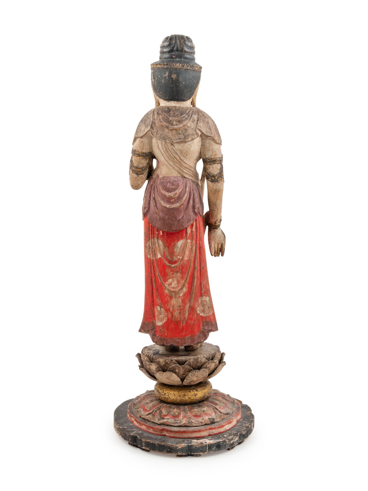A Carved and Polychrome Lacquered Wood Standing Buddha