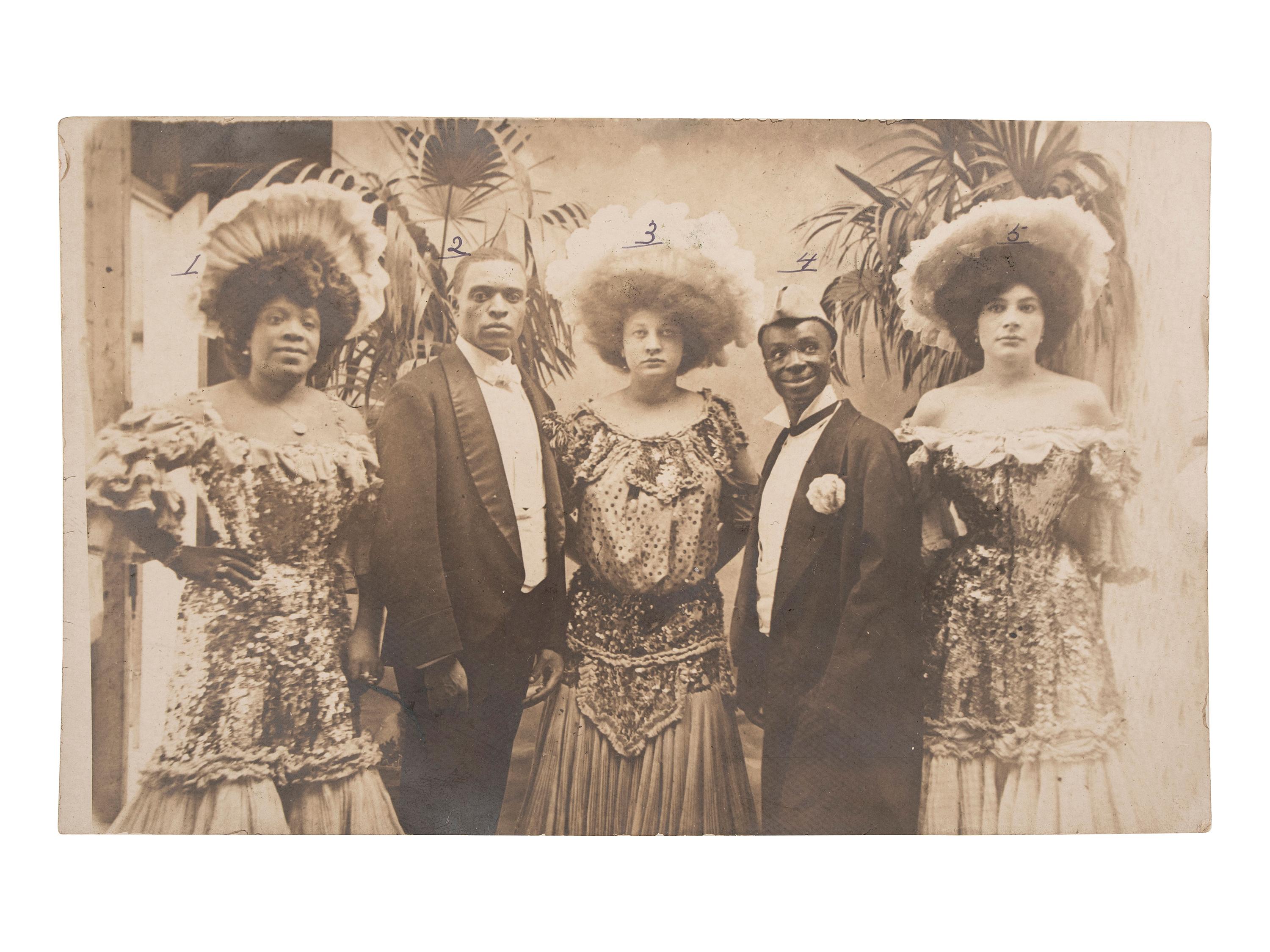 [AFRICAN AMERICANA]--[ENTERTAINMENT]. Real photo postcard of identified Vaudevillle entertainers, incl. interracial couple Sherman and Lulu Coates. 28 July 1906.