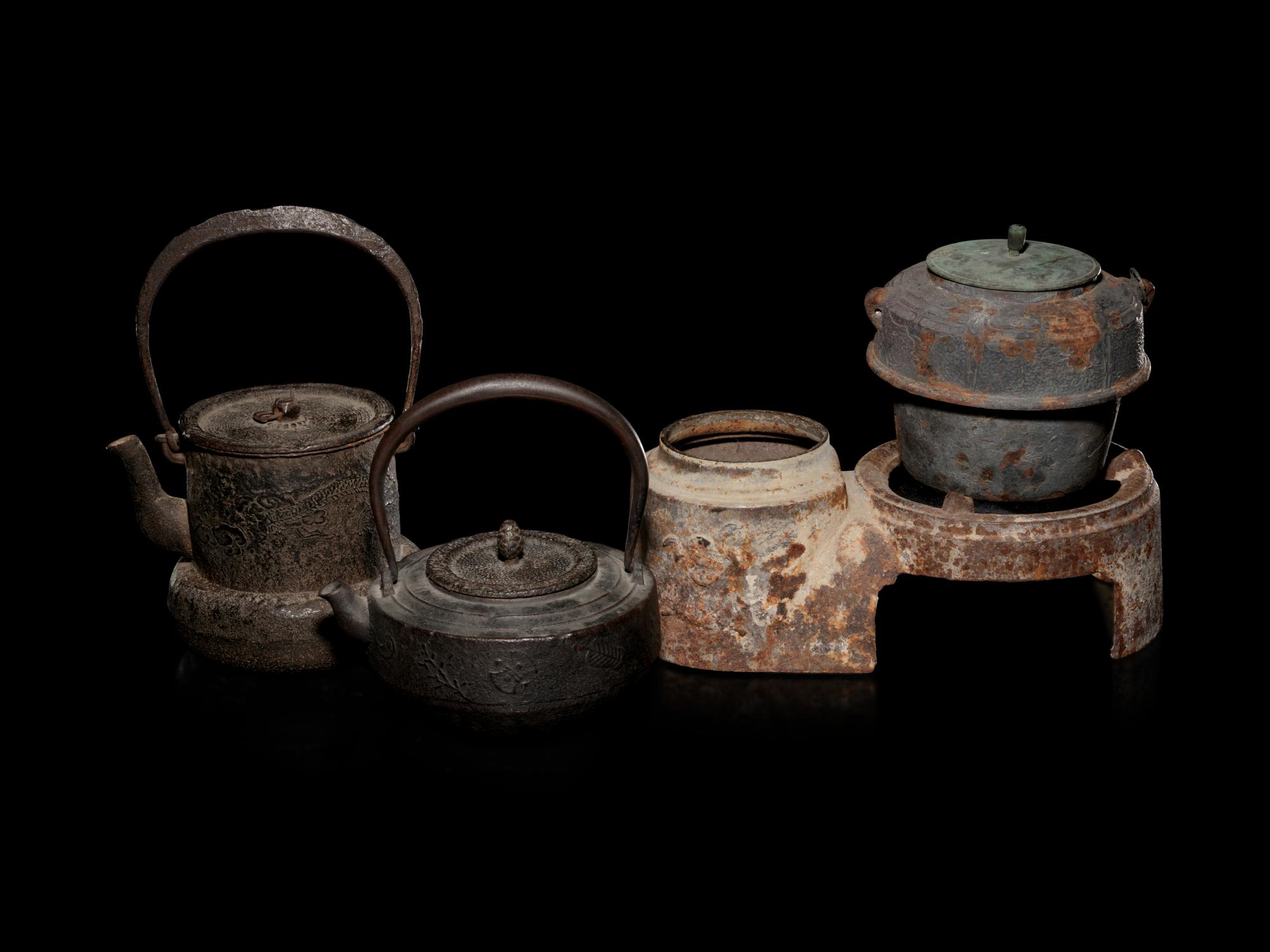 Five Japanese Cast Iron Teapots, Tetsubin , and Burner