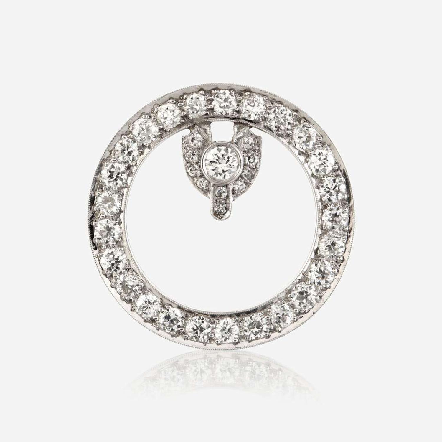A diamond and platinum brooch