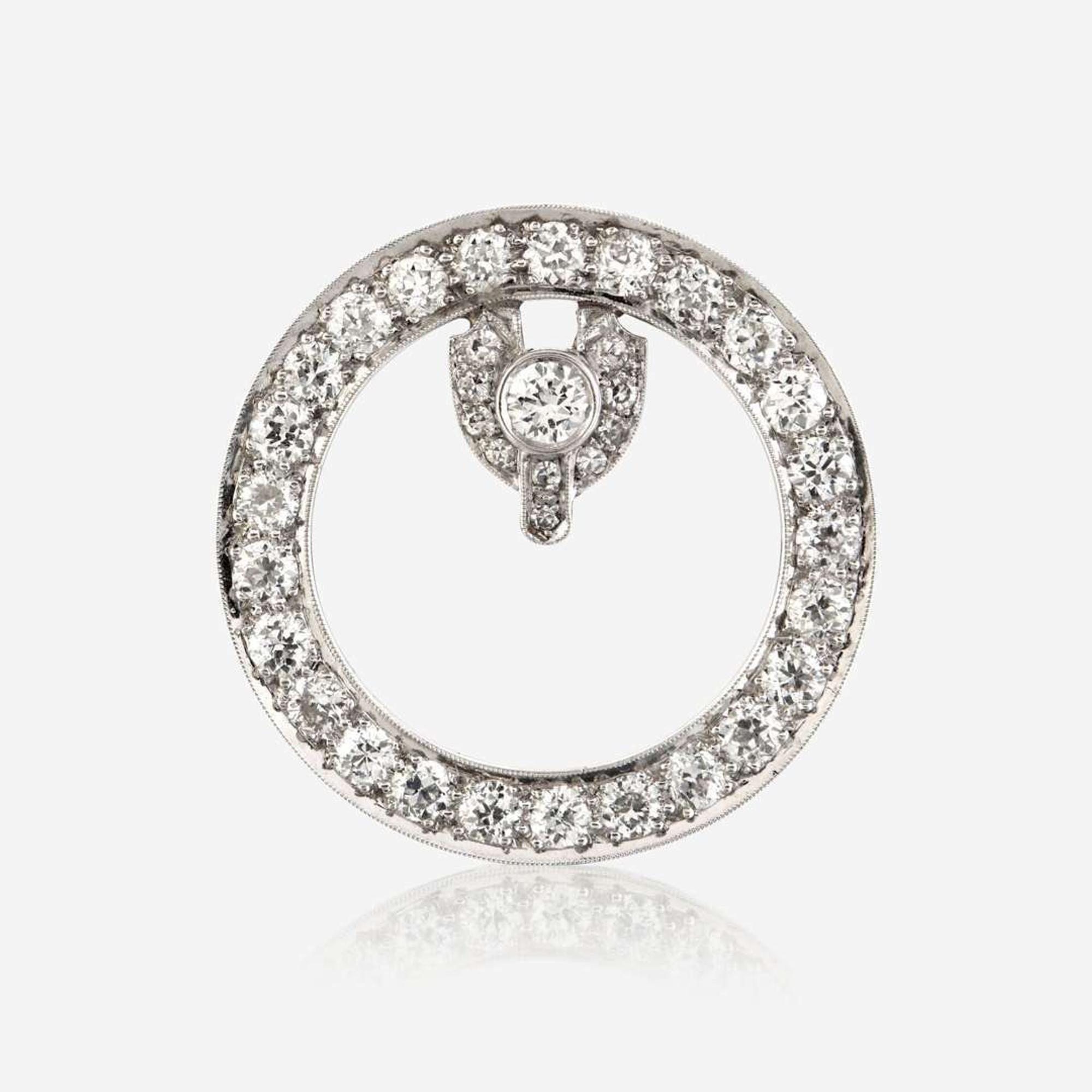 A diamond and platinum brooch