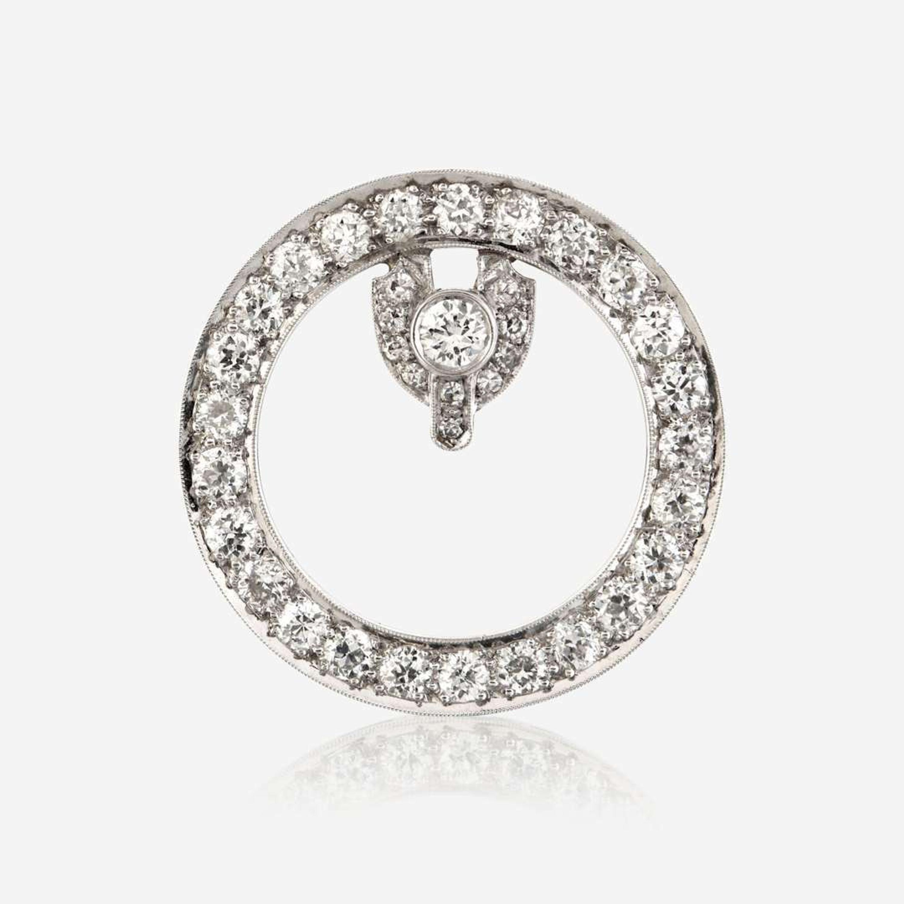 A diamond and platinum brooch
