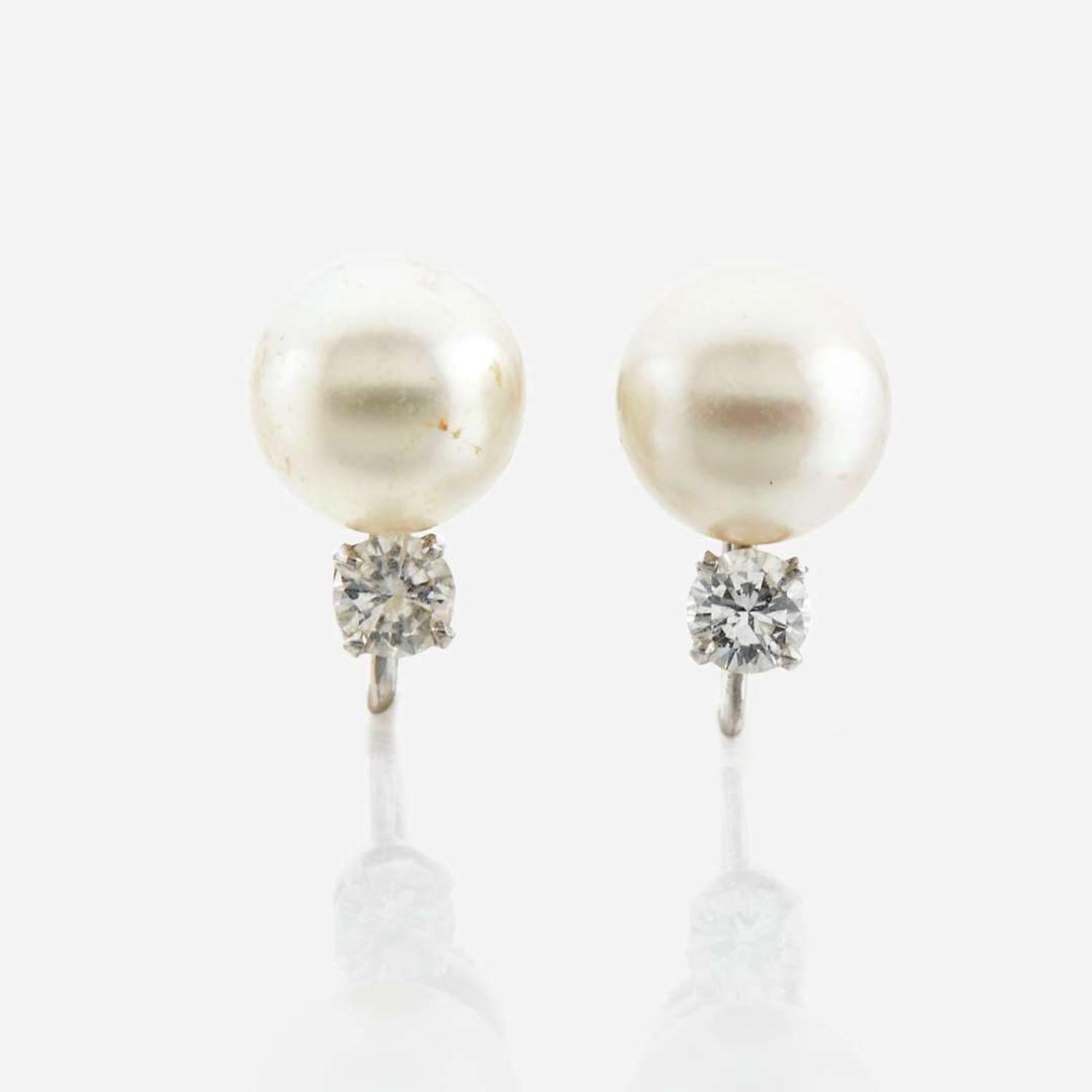 A cultured pearl, diamond, and platinum necklace with similar ear clips