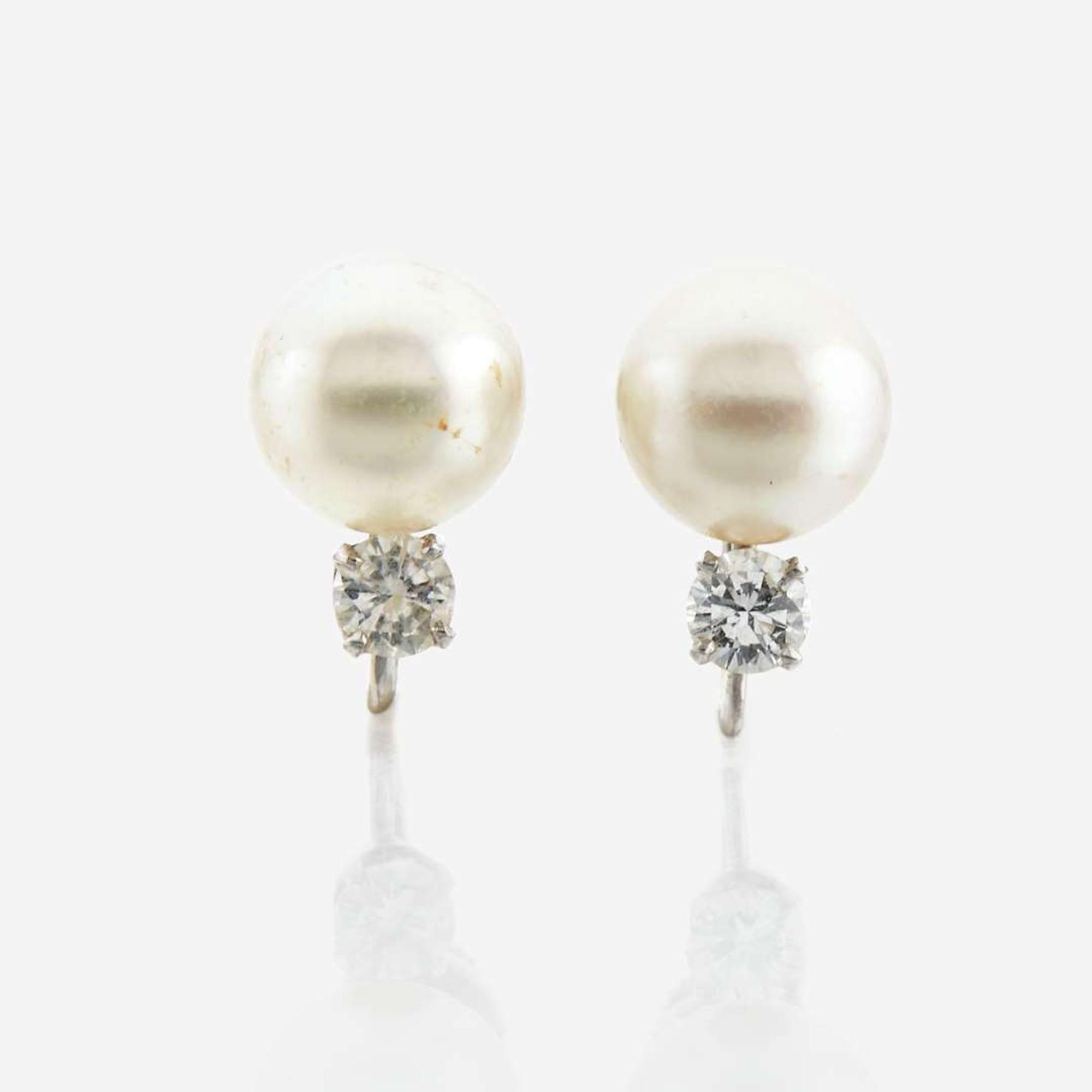 A cultured pearl, diamond, and platinum necklace with similar ear clips