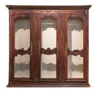 A French Provincial Walnut Bibliotheque, Height 90 x width 87 x depth 15 1/2 inches.