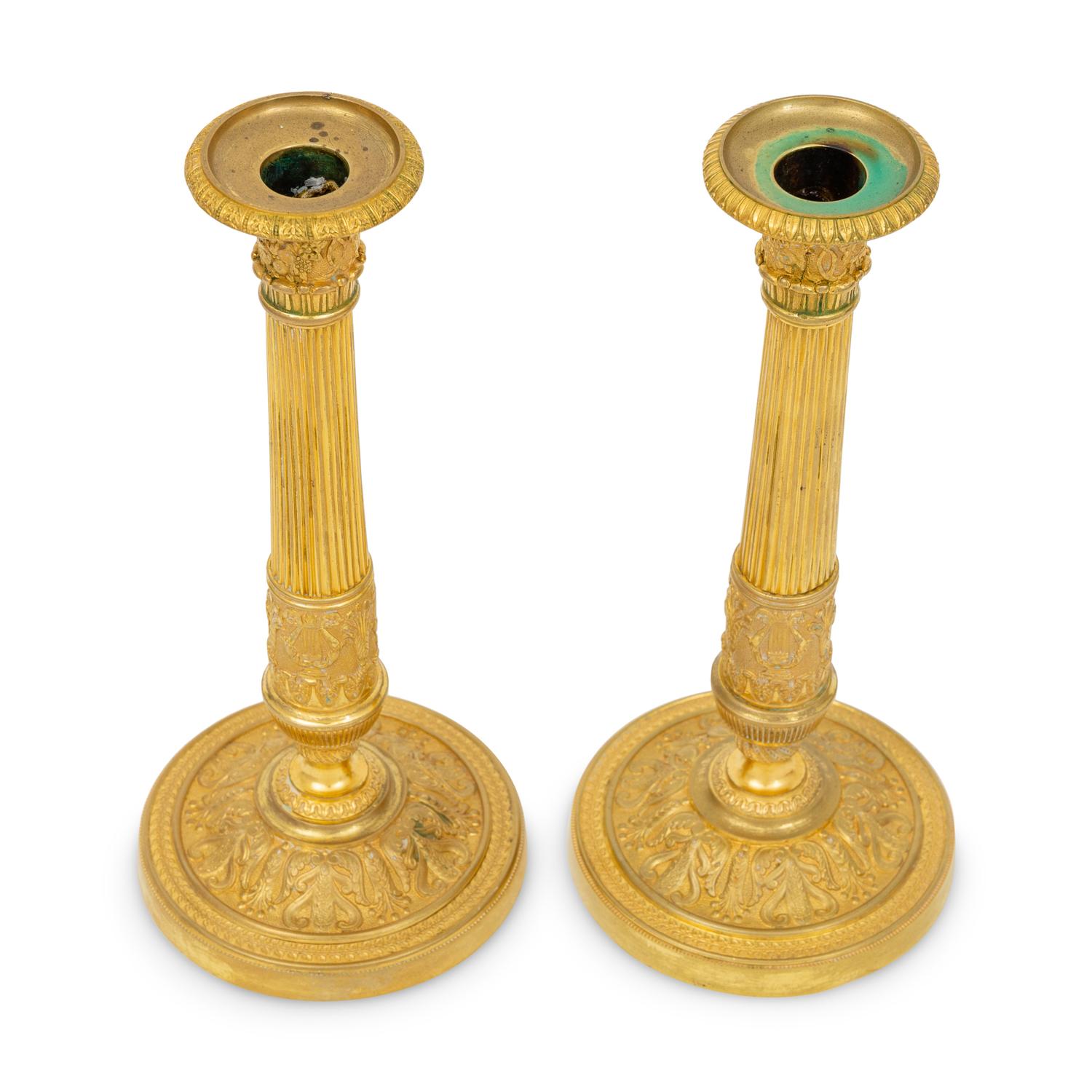 A Pair of French Neoclassical Gilt Bronze Candlesticks