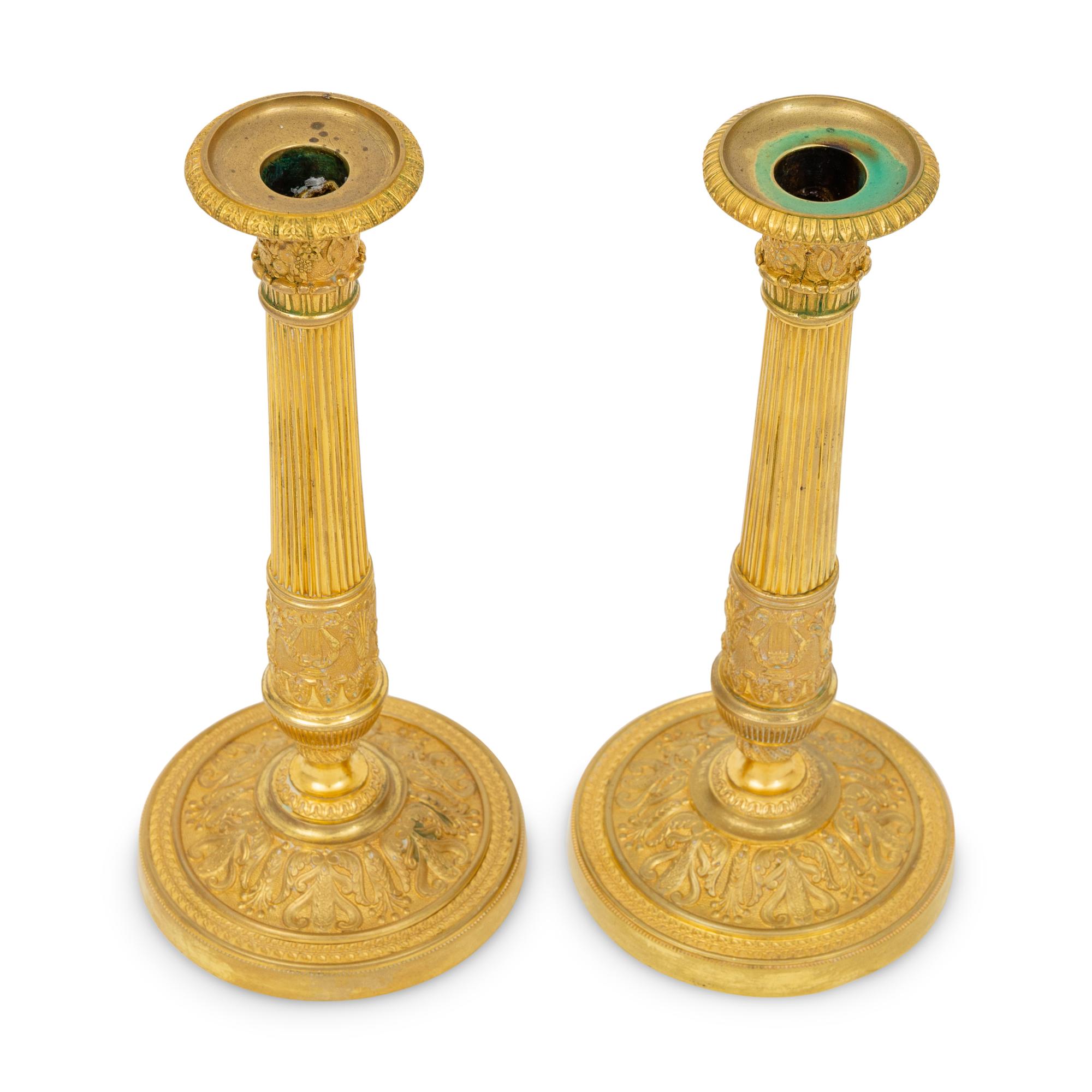 A Pair of French Neoclassical Gilt Bronze Candlesticks