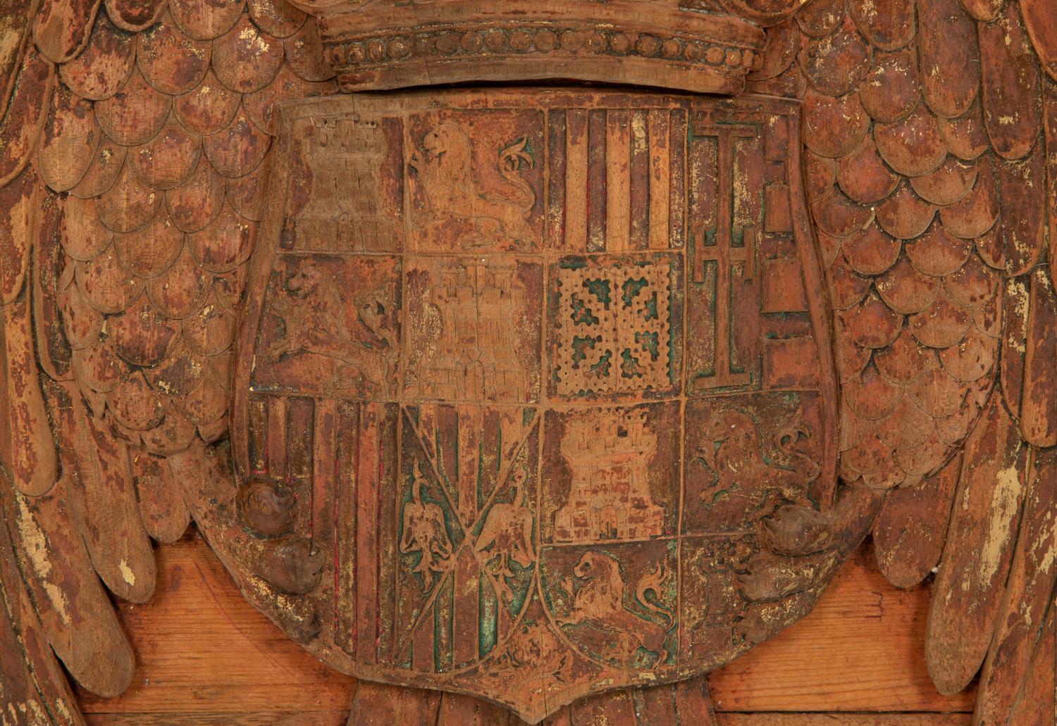 A Continental Carved, Parcel Gilt and Polychrome Painted Heraldic Crest