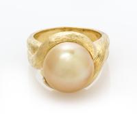 An 18 Karat Yellow Gold and Cultured Golden South Sea Pearl Ring, Henry Dunay, 11.90 dwts.