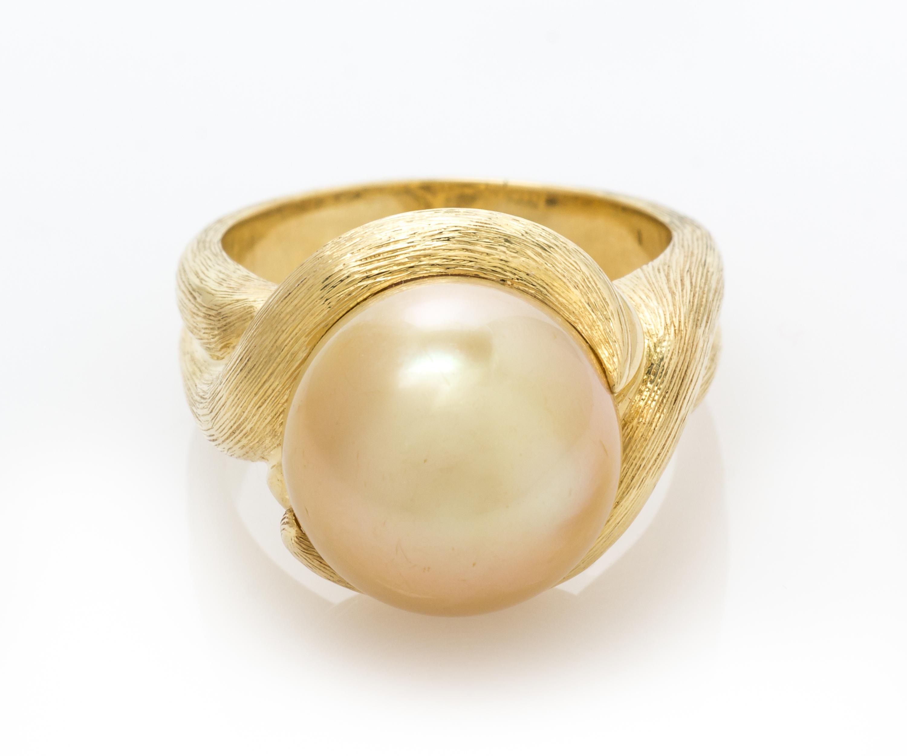 An 18 Karat Yellow Gold and Cultured Golden South Sea Pearl Ring, Henry Dunay, 11.90 dwts.
