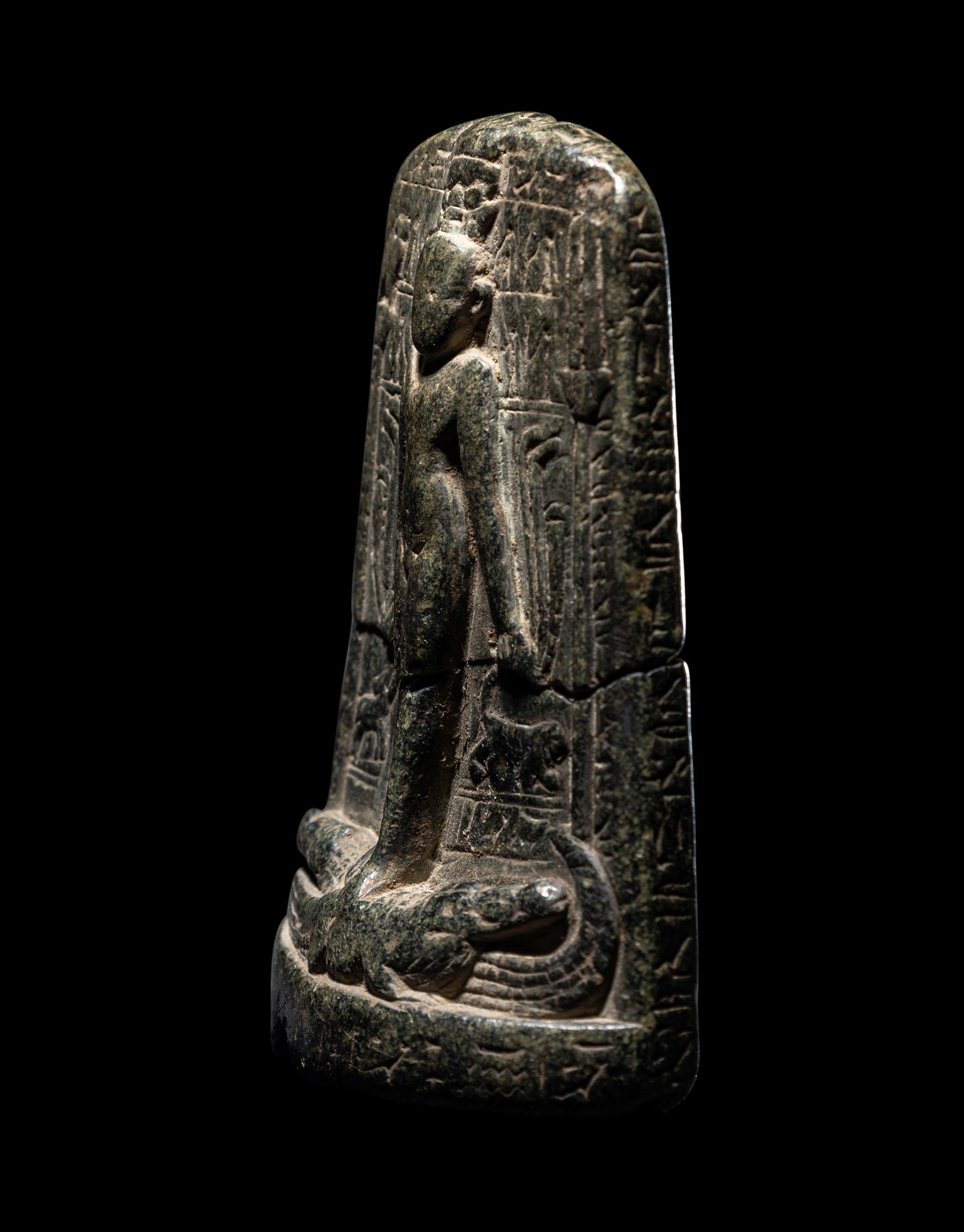 An Egyptian Black Stone Cippus of Horus