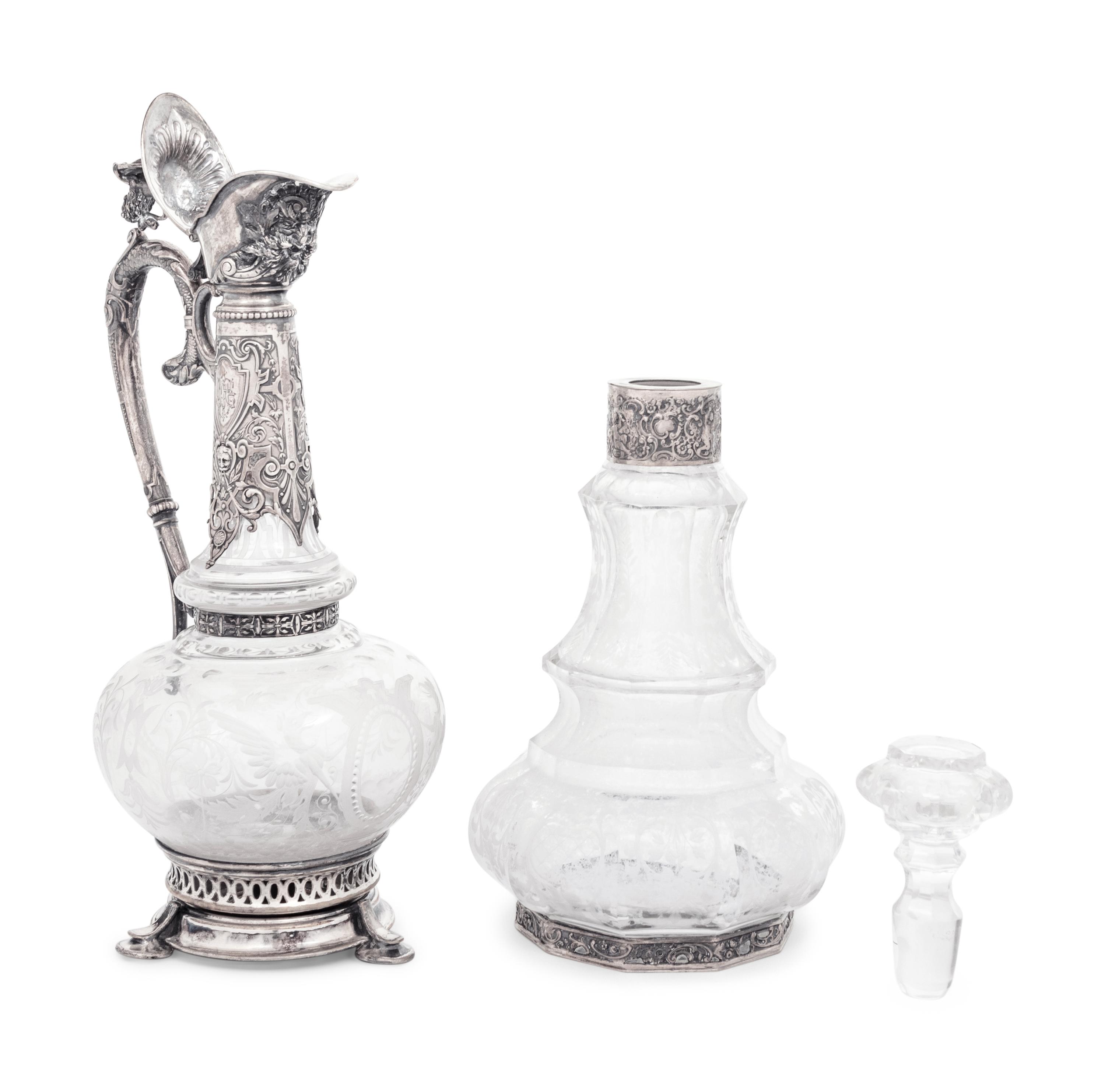 A Continental Silver Mounted Etched Glass Decanter and an English Silver-Plate Mounted Etched Glass Claret Jug