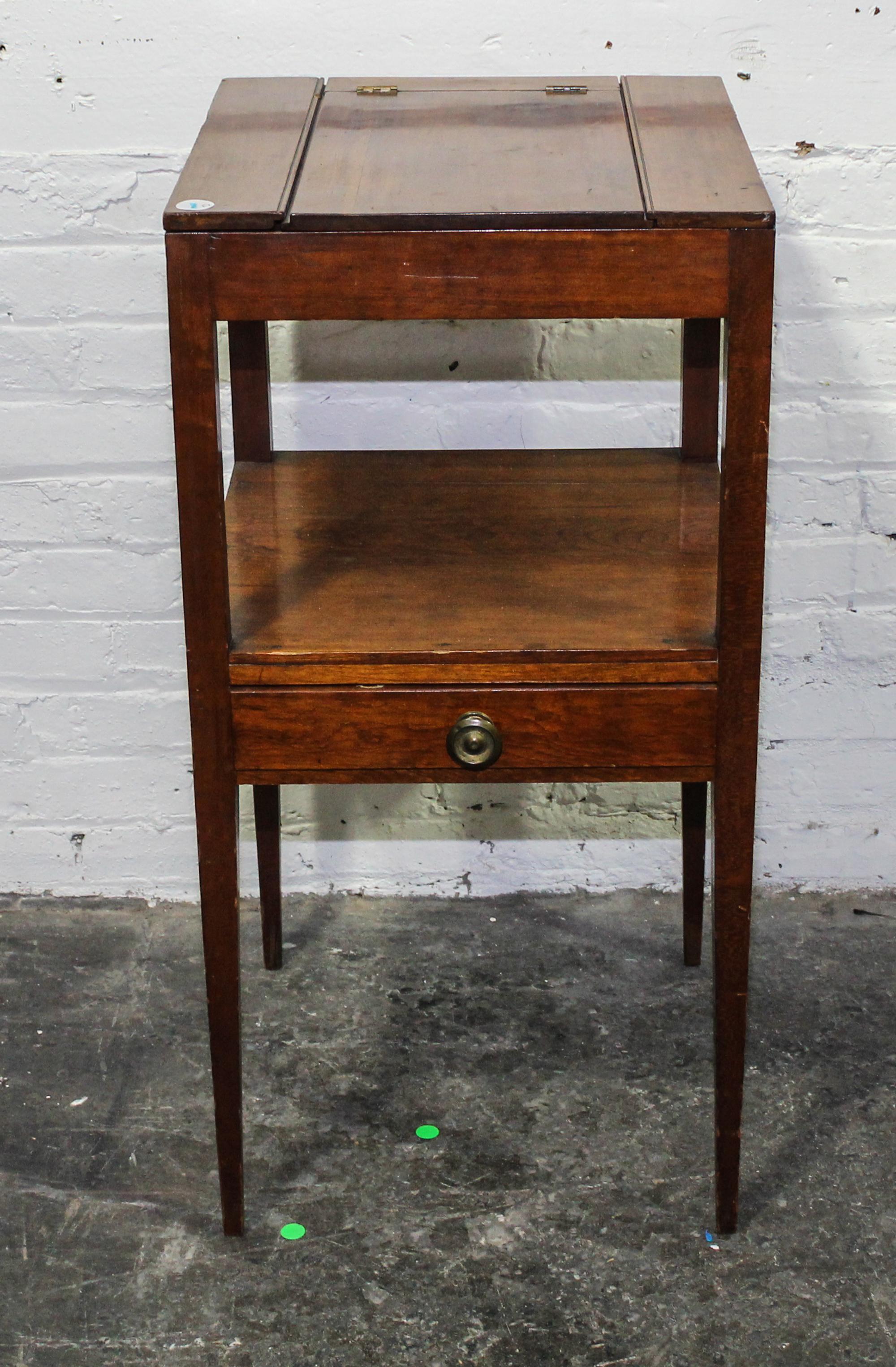 An English Mahogany Dressing Table Height 33 x width 16 x depth 16 3/4 inches (closed). — 19TH CENTURY