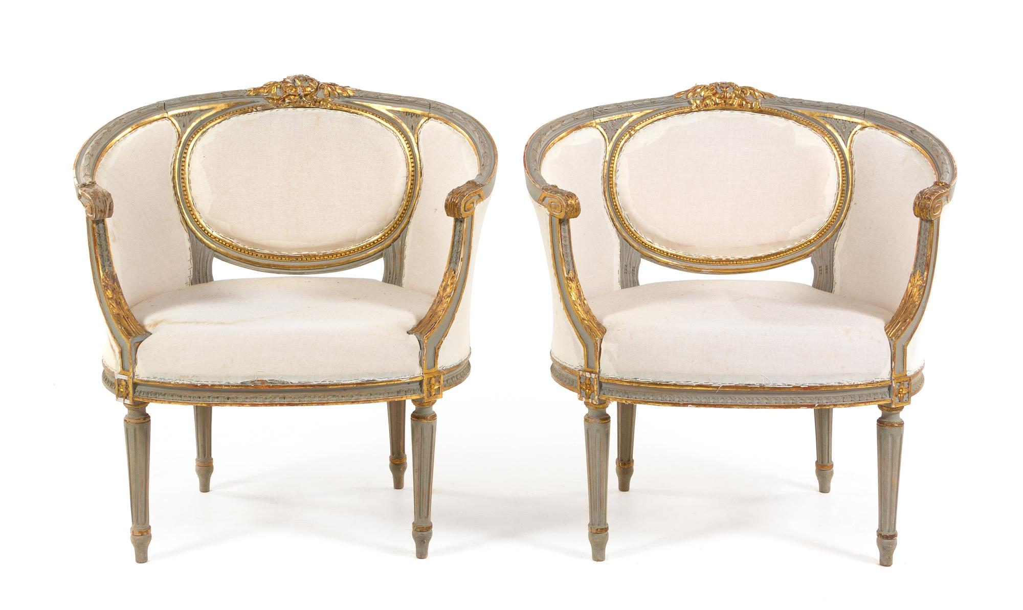 A Pair of Louis XVI Style Painted and Parcel Gilt Bergeres Height 31 1/2 x width 30 5/8 inches. — 19TH CENTURY