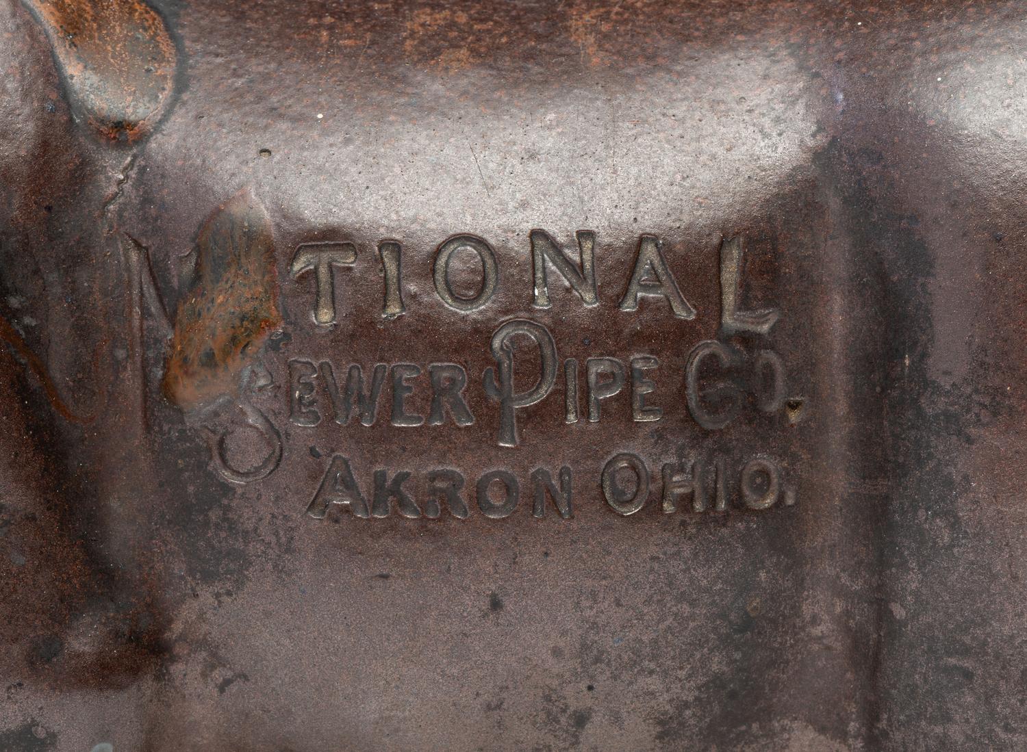 A Glazed Sewer Tile Advertising Pig
