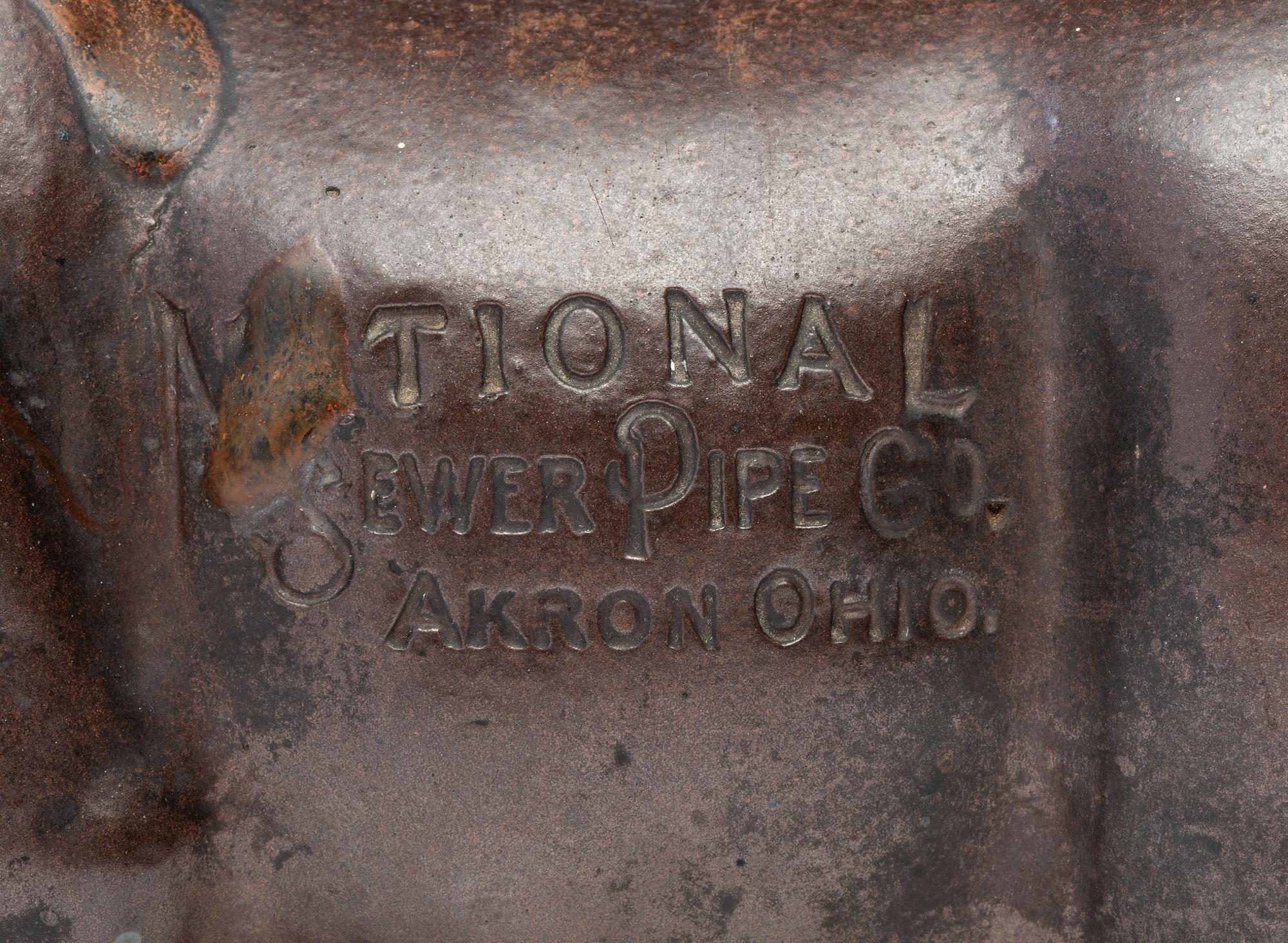 A Glazed Sewer Tile Advertising Pig