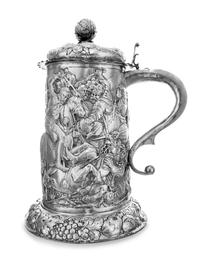 A German Silver Tankard, Hanau Marks, 19th Century, topped with a pomegranate finial, the body worked to show a medieval battle scene,
