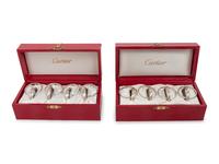 Two Cased Sets of Four Cartier Trinity Silver Napkin Rings
