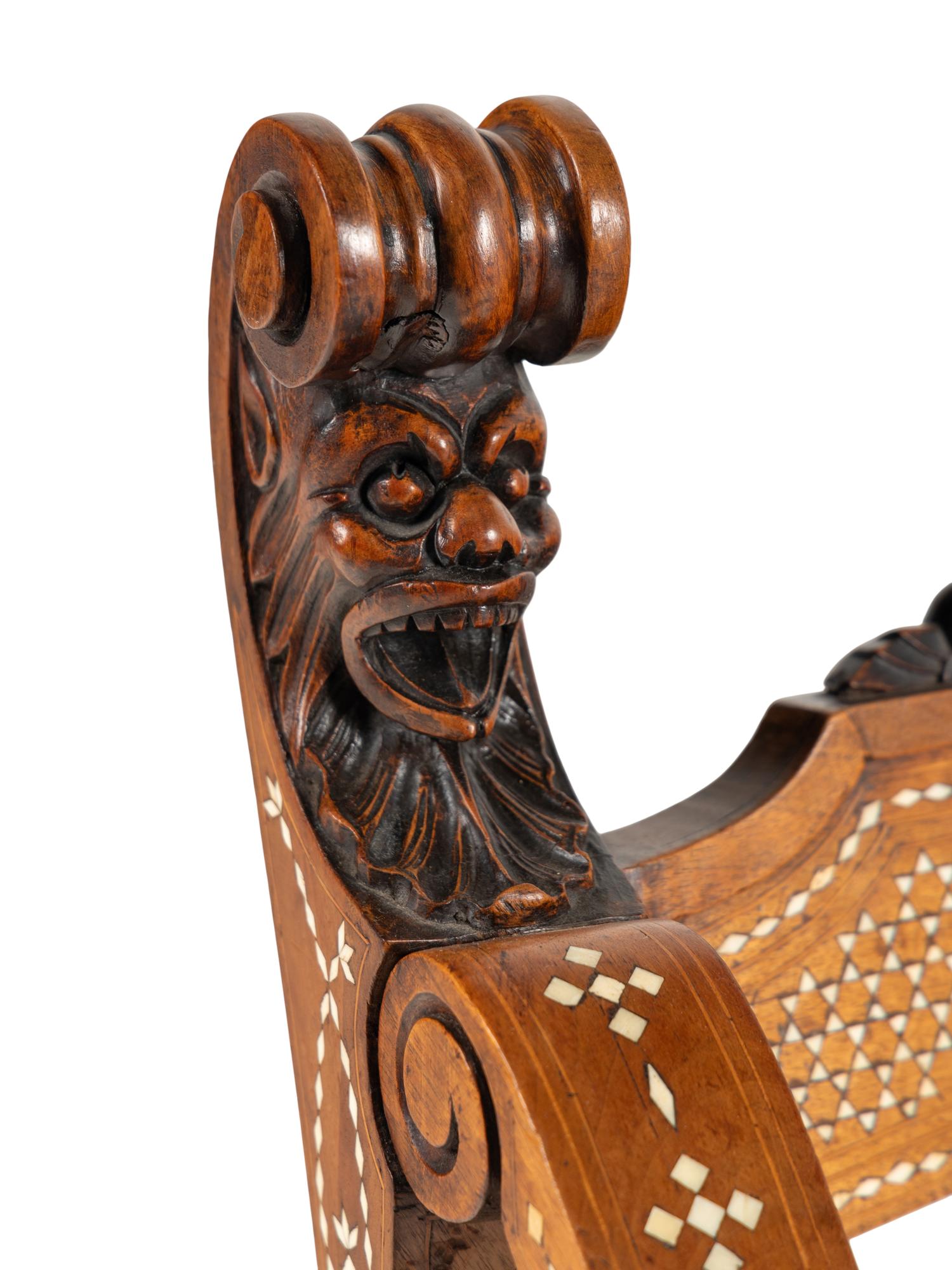 A North Italian Carved Walnut and Bone-Inlaid Savonarola Chair