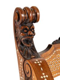 A North Italian Carved Walnut and Bone-Inlaid Savonarola Chair