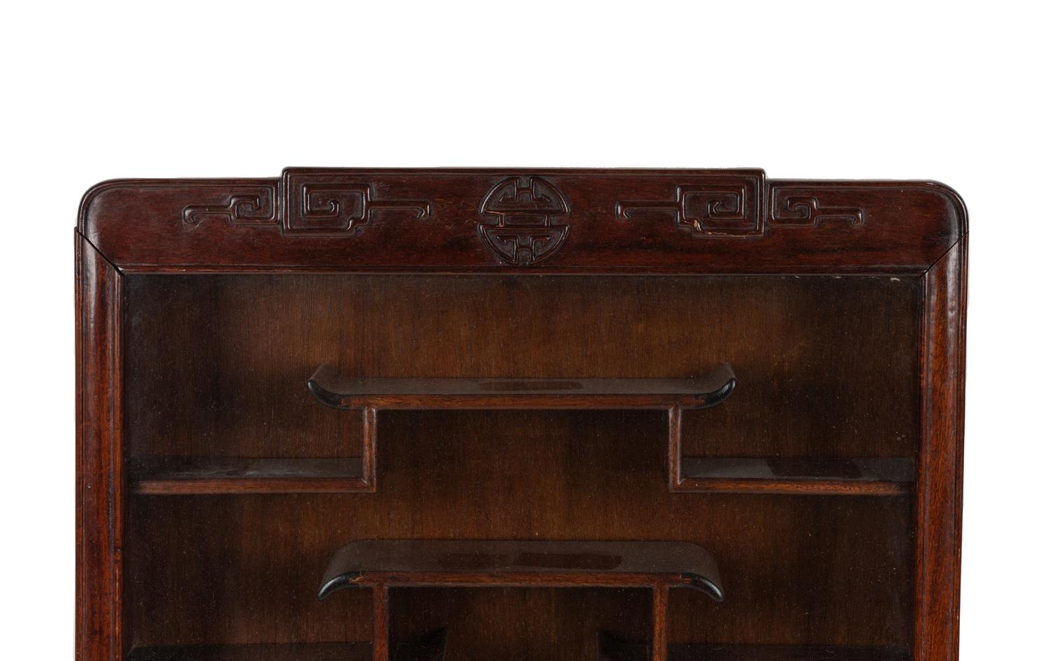 A Pair of Chinese Carved Hardwood Vitrine Cabinets
