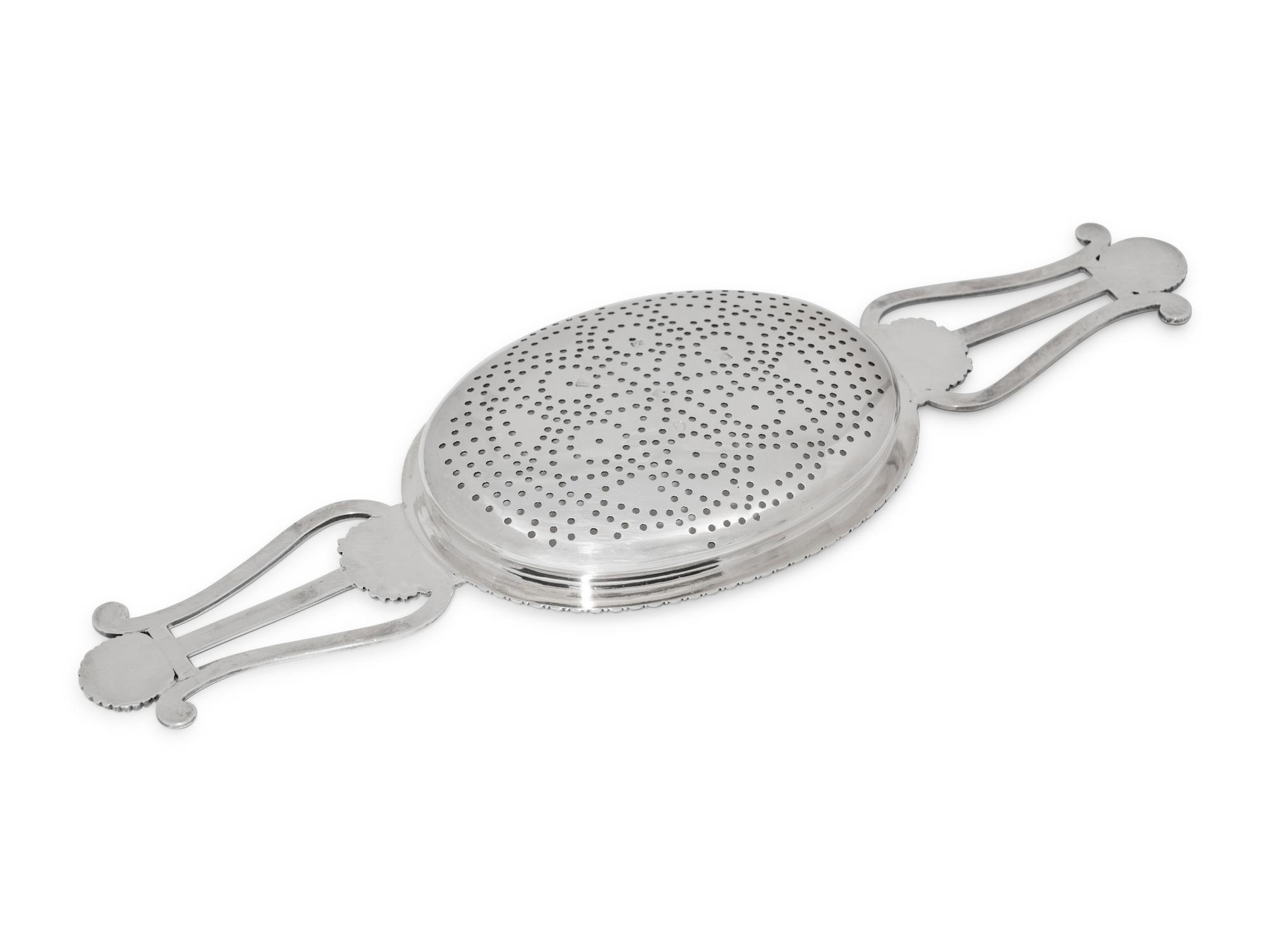 A Scottish George IV Silver Lyre Form Lemon Strainer
