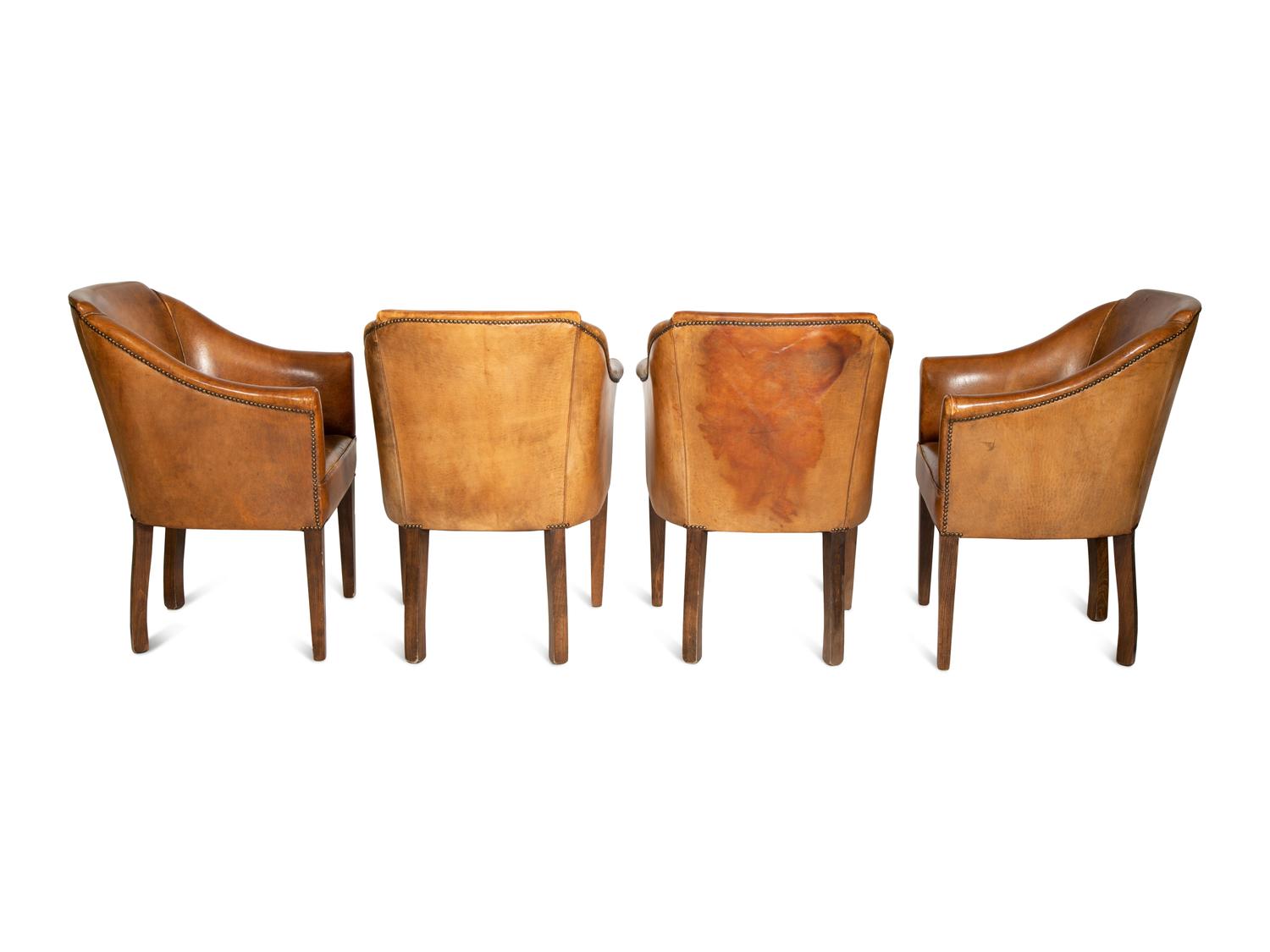 A Set of Four Leather-Upholstered Barrel-Back Armchairs