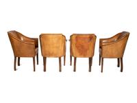 A Set of Four Leather-Upholstered Barrel-Back Armchairs