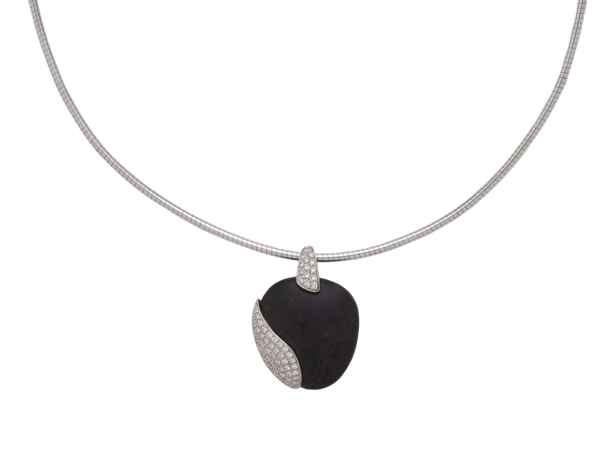 MOVADO, WHITE GOLD, PEBBLE AND DIAMOND SET