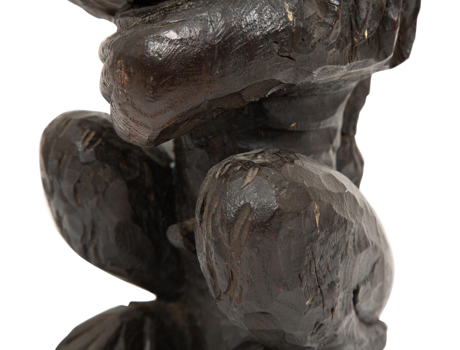 An English Carved and Stained Oak Figure of a Lion